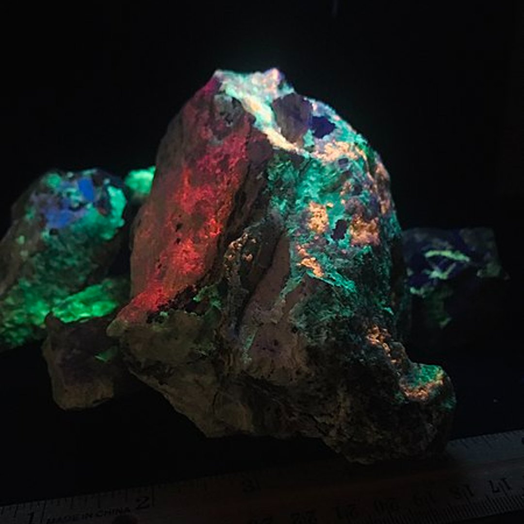 You can see how imperfections in these rocks collected from a mine are illuminated under UV light