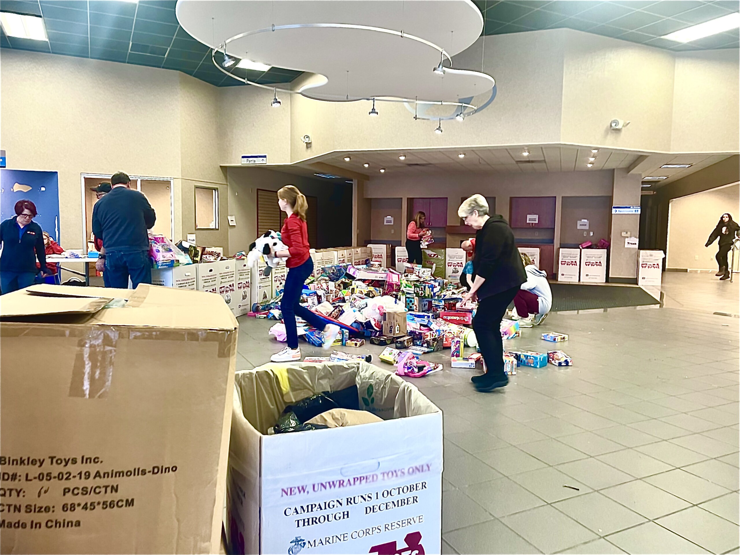 Volunteers Help Organize Toys For Tots Donations Just In Time For The ...