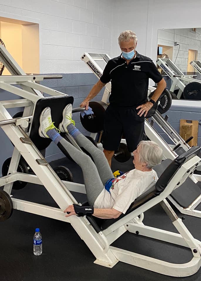 Vern Gauthier assists a client at Fit For You Health Club.