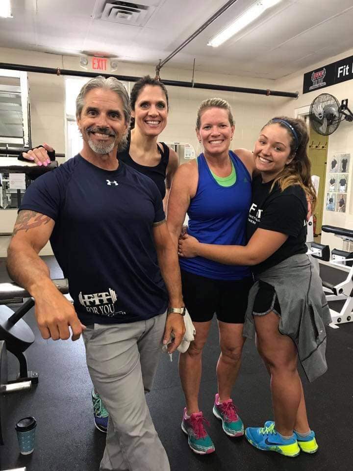 Vern Gauthier poses for a photo with some of his clients at Fit For You Health Club.