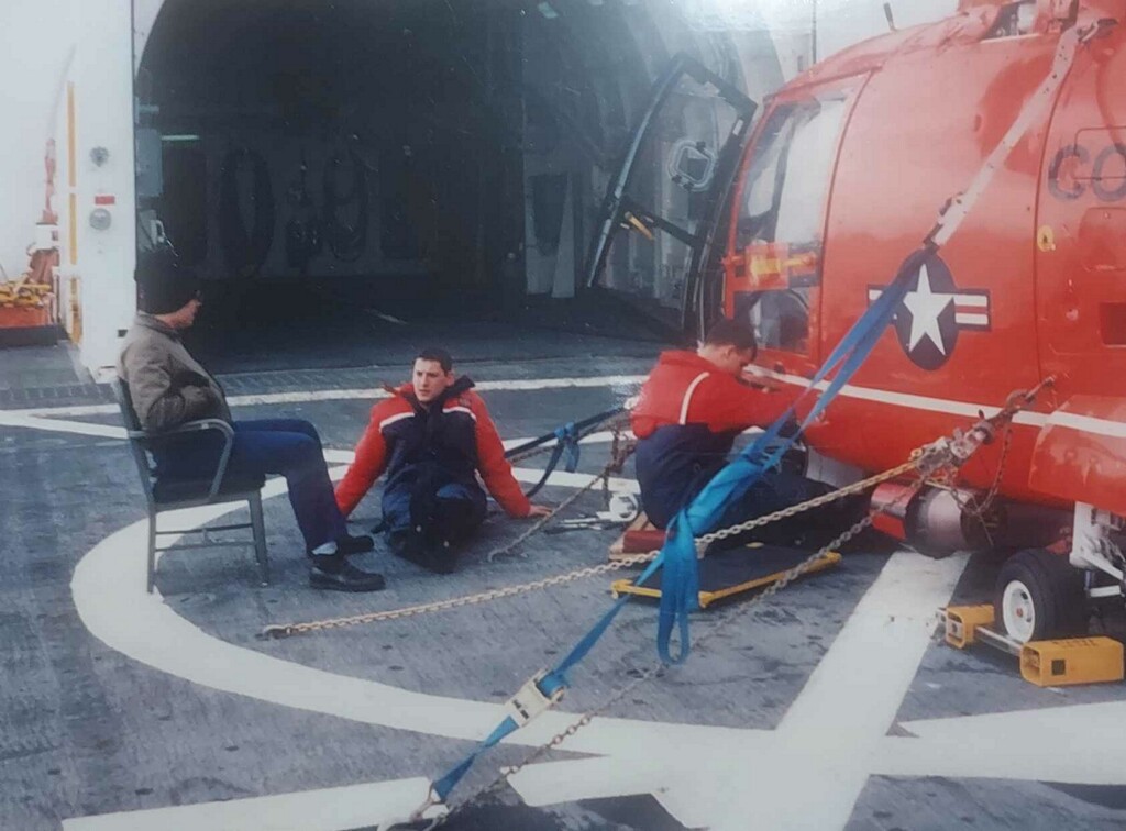 Crew members rest on deck in between rescue missions in Alaska.