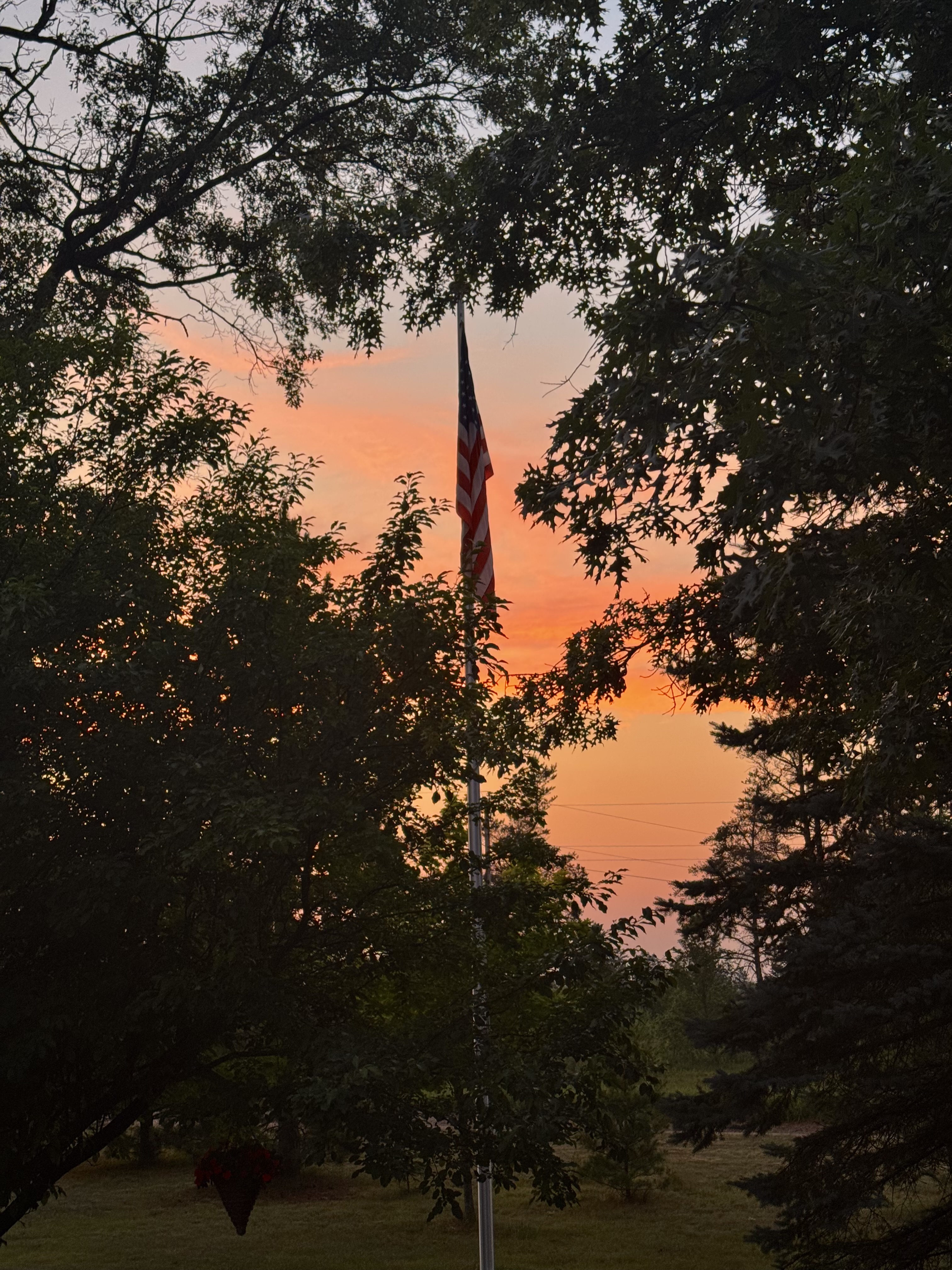 Sunset and our American flag. 
July 13, 2025