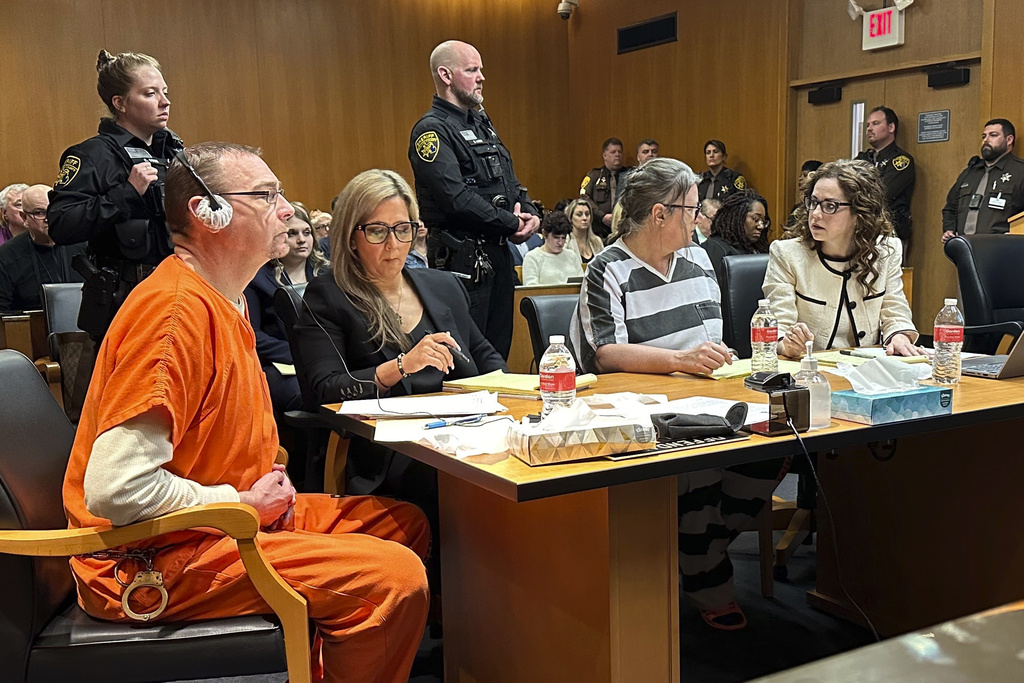 From left,  James Crumbley, defense lawyer Mariell Lehman, Jennifer Crumbley, and defense lawyer Shannon Smith await sentencing in Oakland County, Mich., court on Tuesday, April 9, 2024.