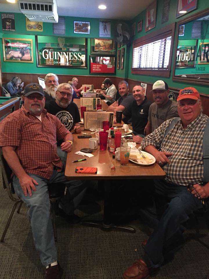 MacIntyre pictured with old military buddies catching up at Brady's in Traverse City