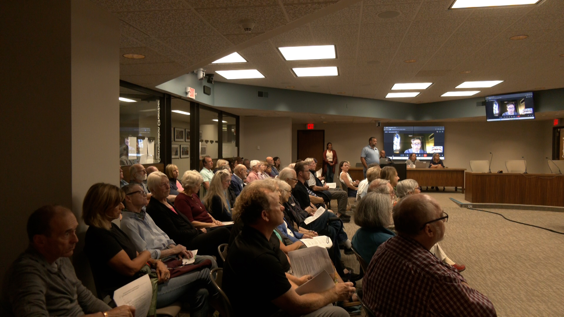 Traverse City hits pause on a neighborhood tax break after an overflow crowd pushes back