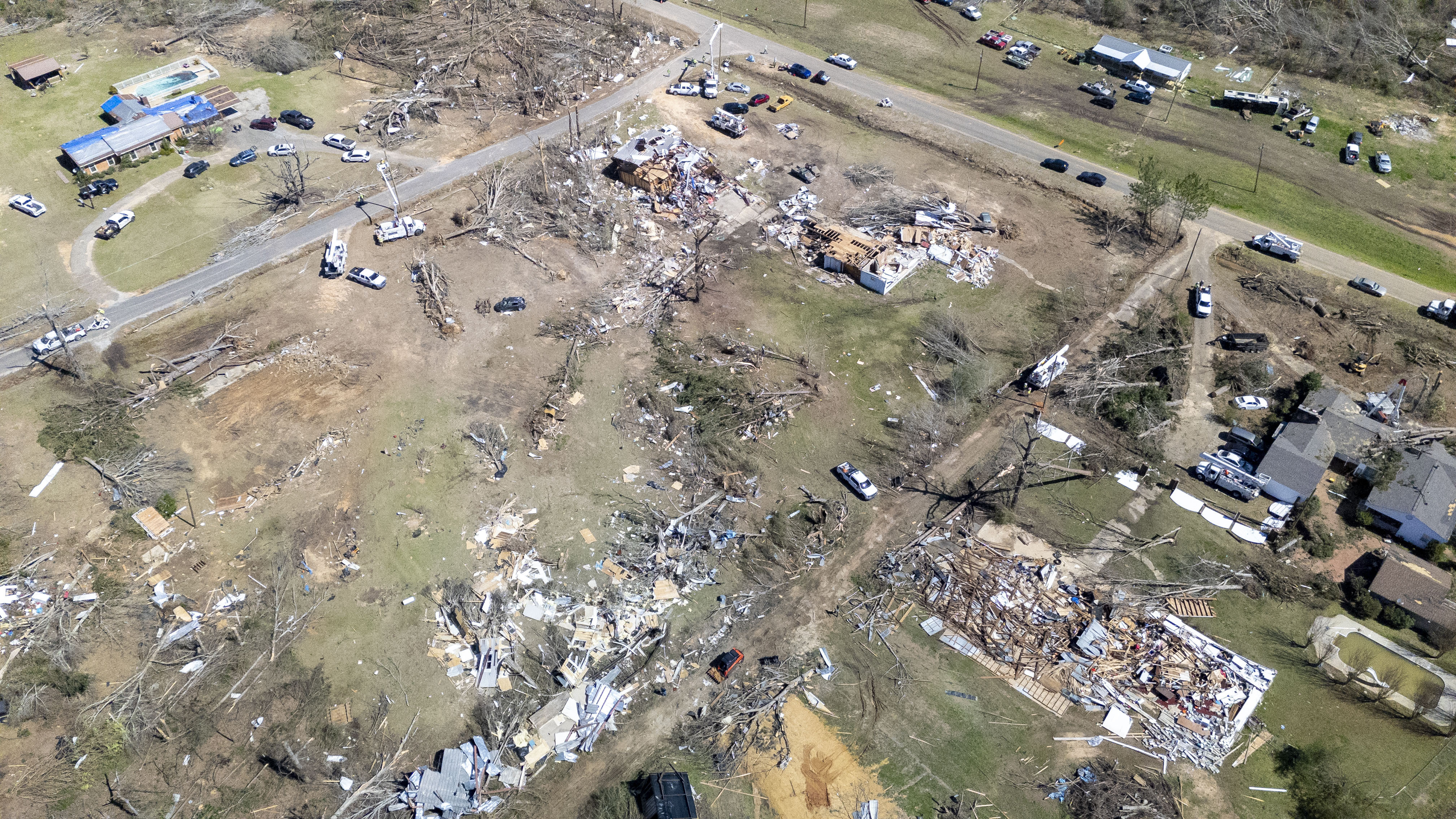Residents pick up the pieces after devastating storms scour the