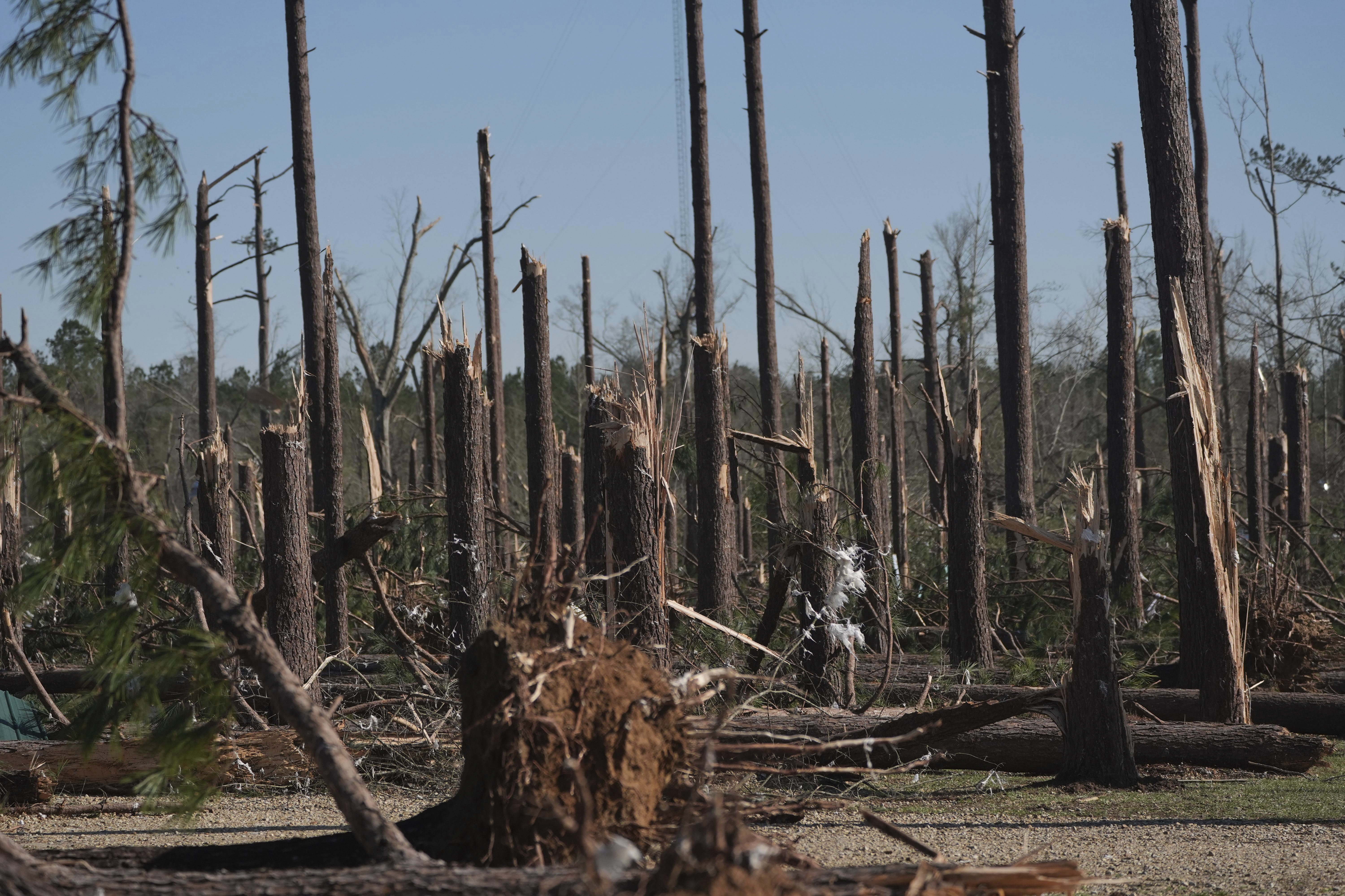 Residents pick up the pieces after devastating storms scour the