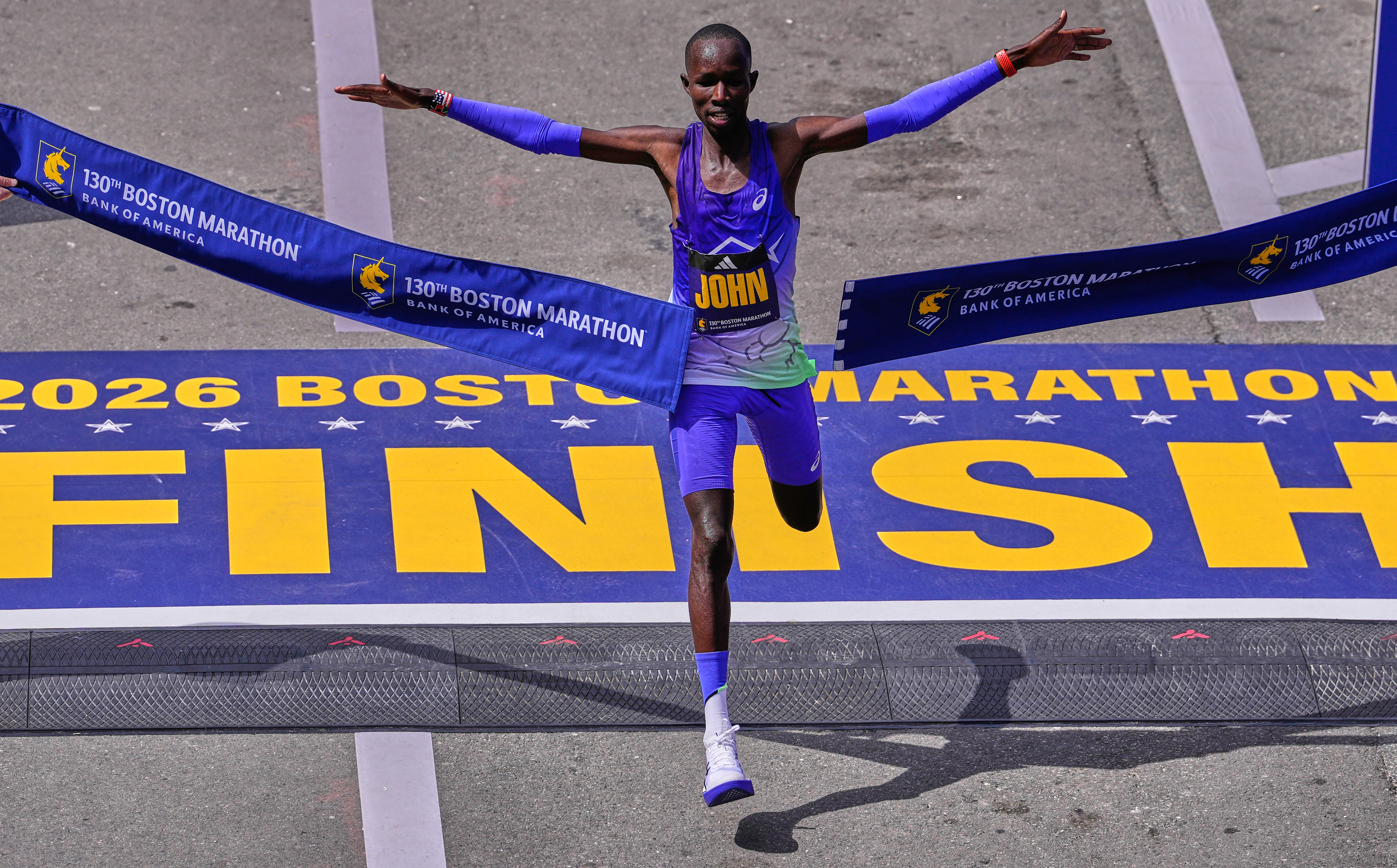 Defending champion John Korir breaks Boston Marathon record, and