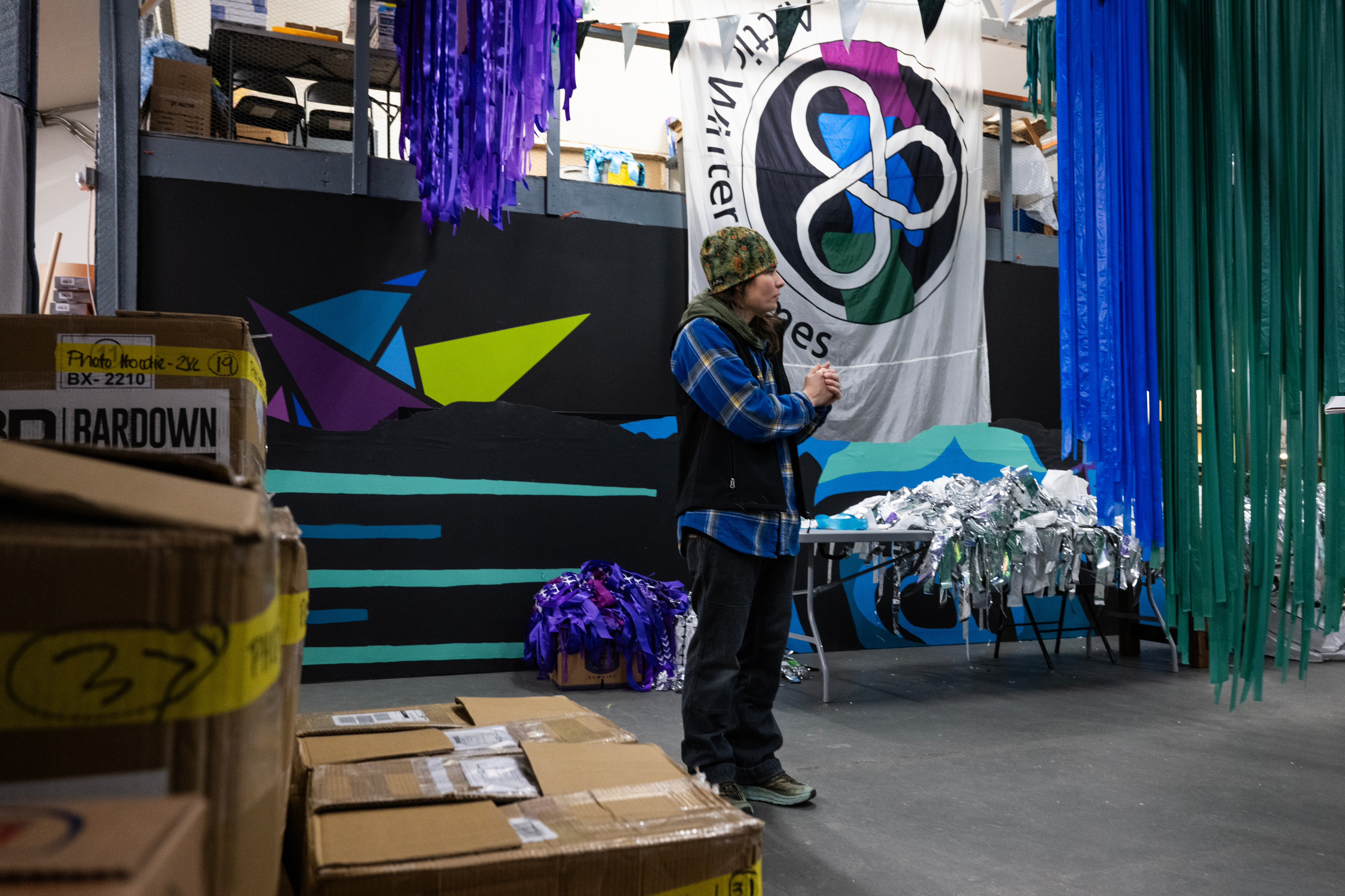 Volunteers make wolf fur pompoms for Yukon's Arctic Winter Games athletes