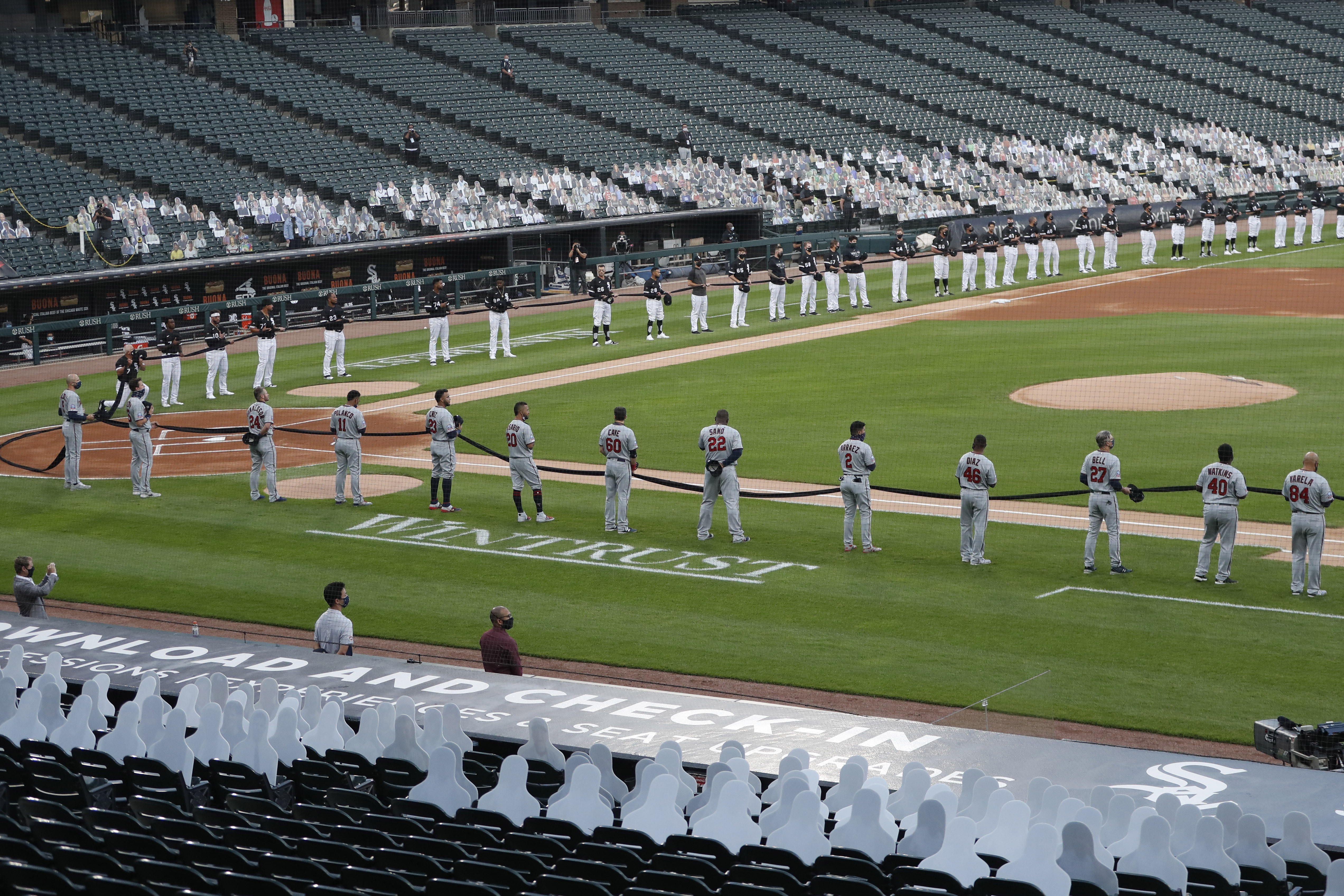 Empty stands, masked players as baseball returns