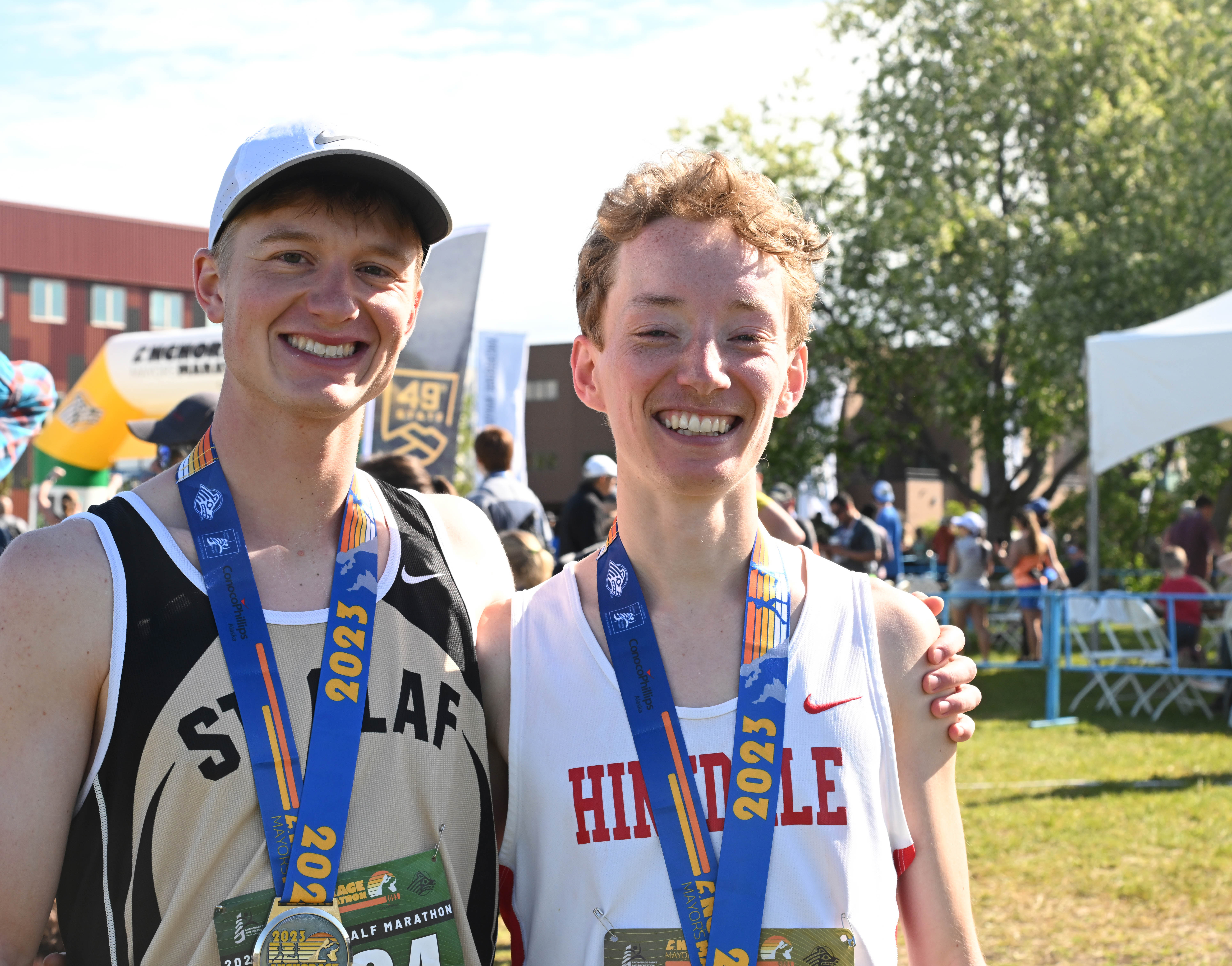 Friends and former college teammates win half and full marathons