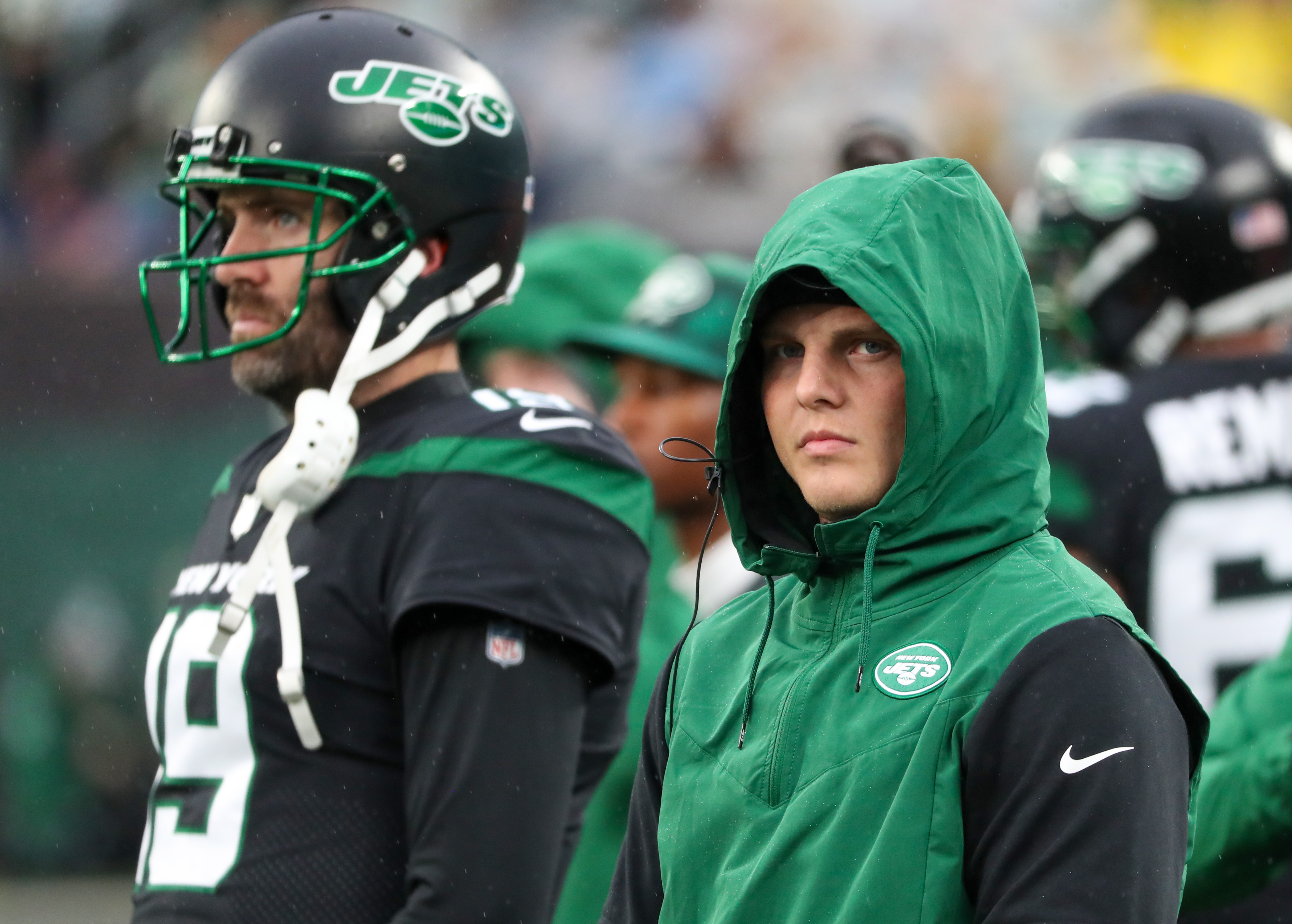 New york jets players wearing mike f'n white shirt, hoodie