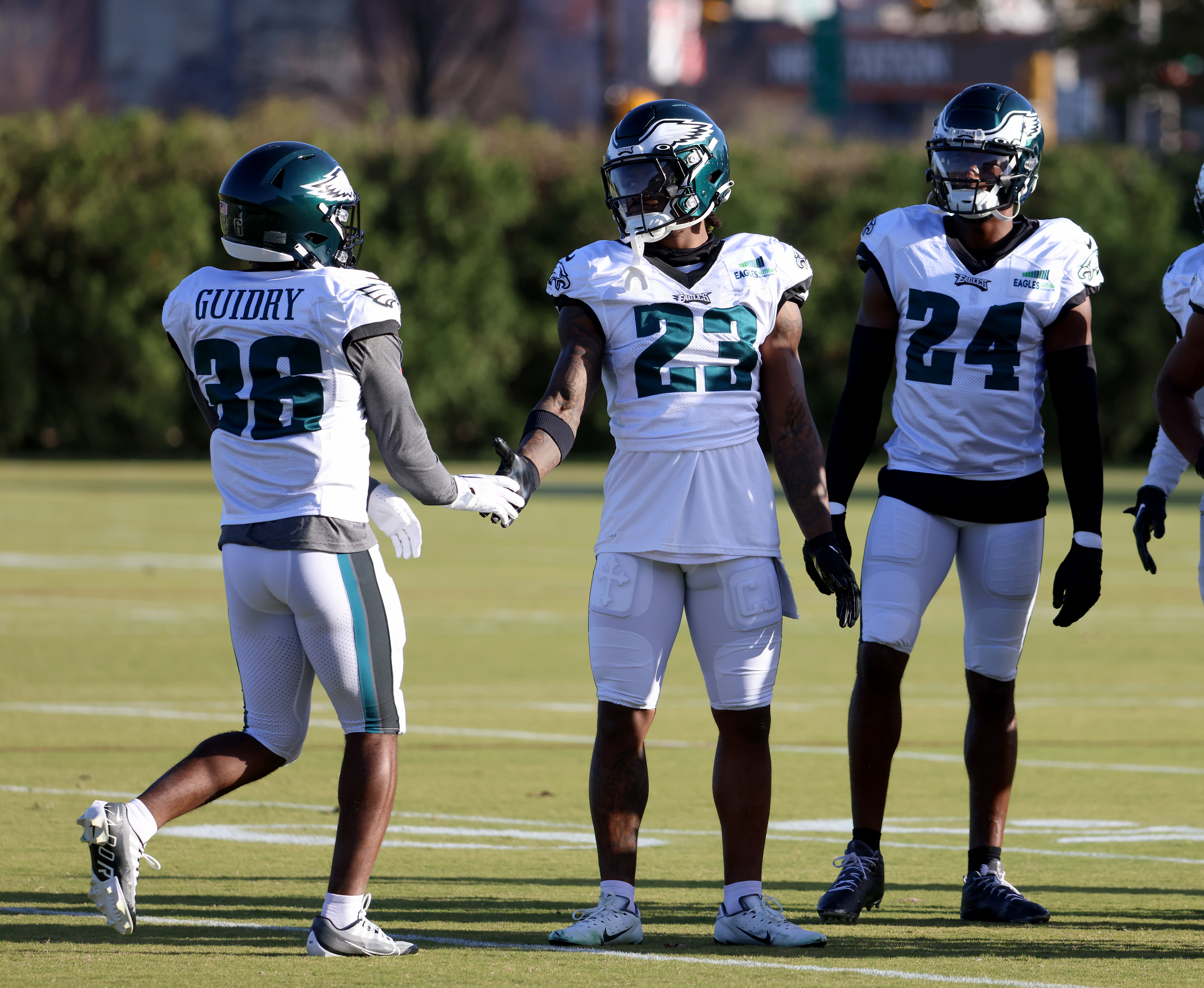 Philadelphia Eagles defensive tackle Javon Hargrave (97) pulls down  Washington Commanders quarterback Carson Wentz (11) during