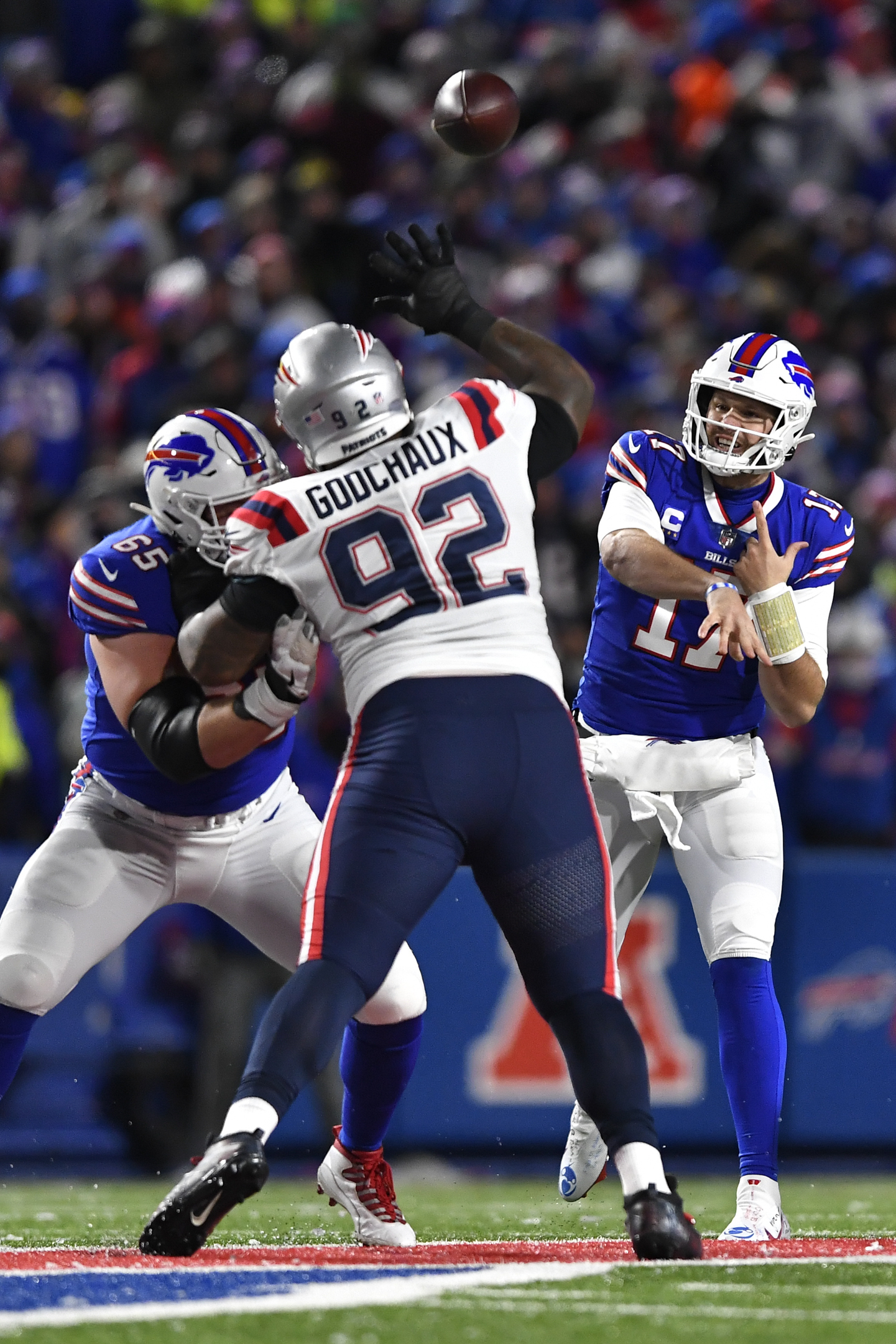 New England Patriots quarterback Mac Jones (10) looks to throw a pass  during the first half of an NFL football game against the Buffalo Bills in  Orchard Park, N.Y., Monday, Dec. 6