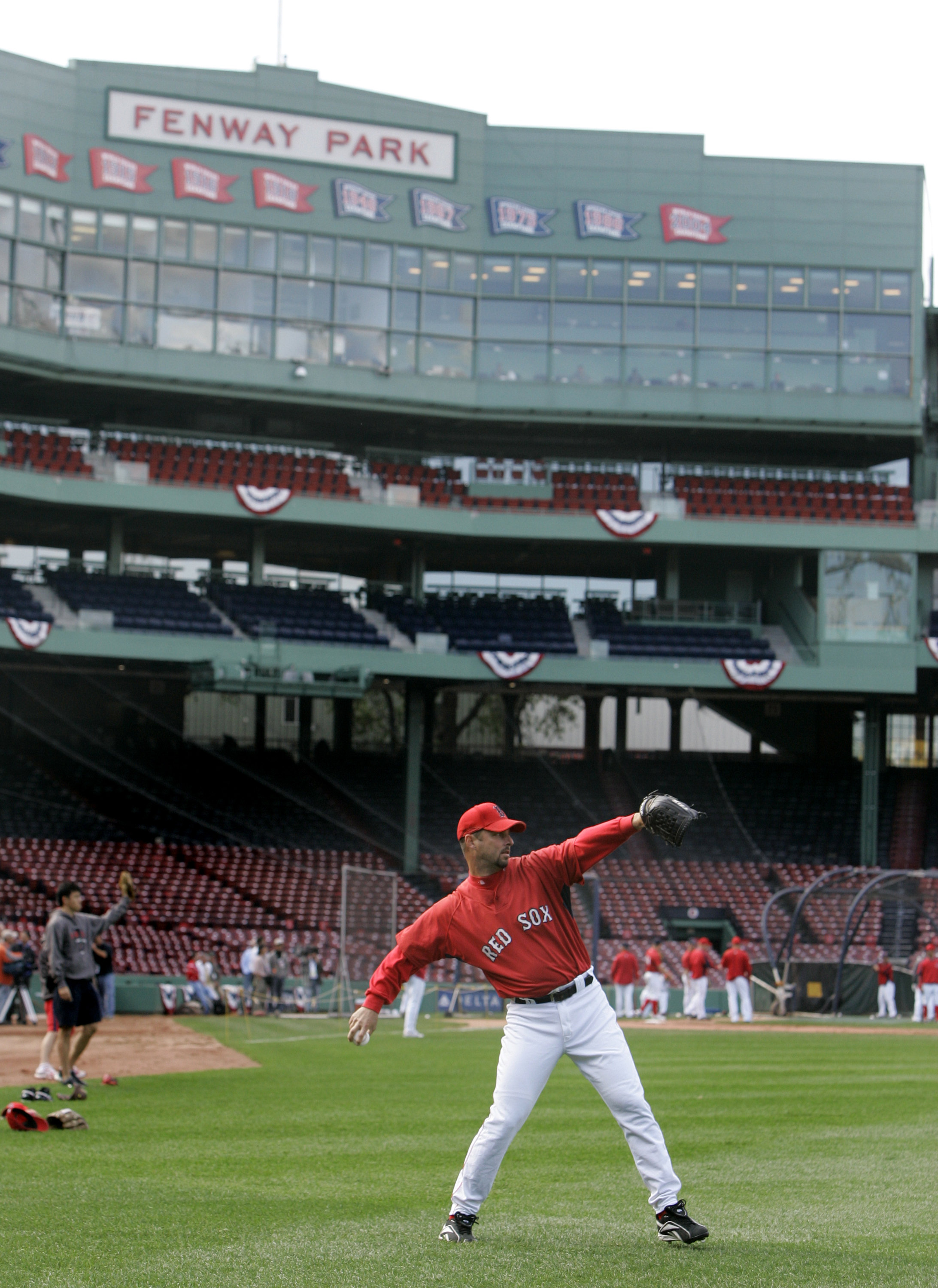 Boston Red Sox catcher Jason Varitek waves to the crowd at Fenway Park as  he walks out to receive his 2007 World Series ring in a ceremony before the Red  Sox home