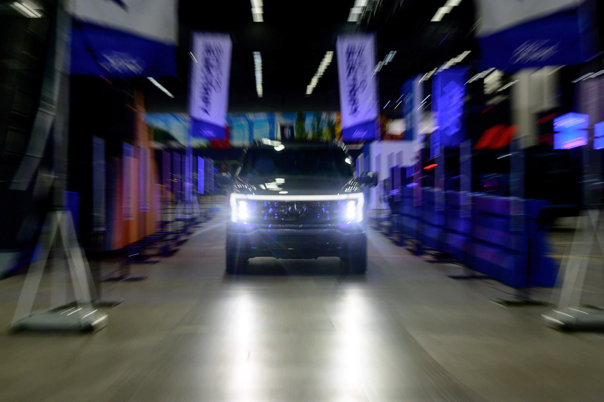 A Ford F-150 Lightning demonstrates at the 2022 North American International Auto Show begins with media preview day at Huntington Place in Detroit on Wednesday, Sept. 14 2022.