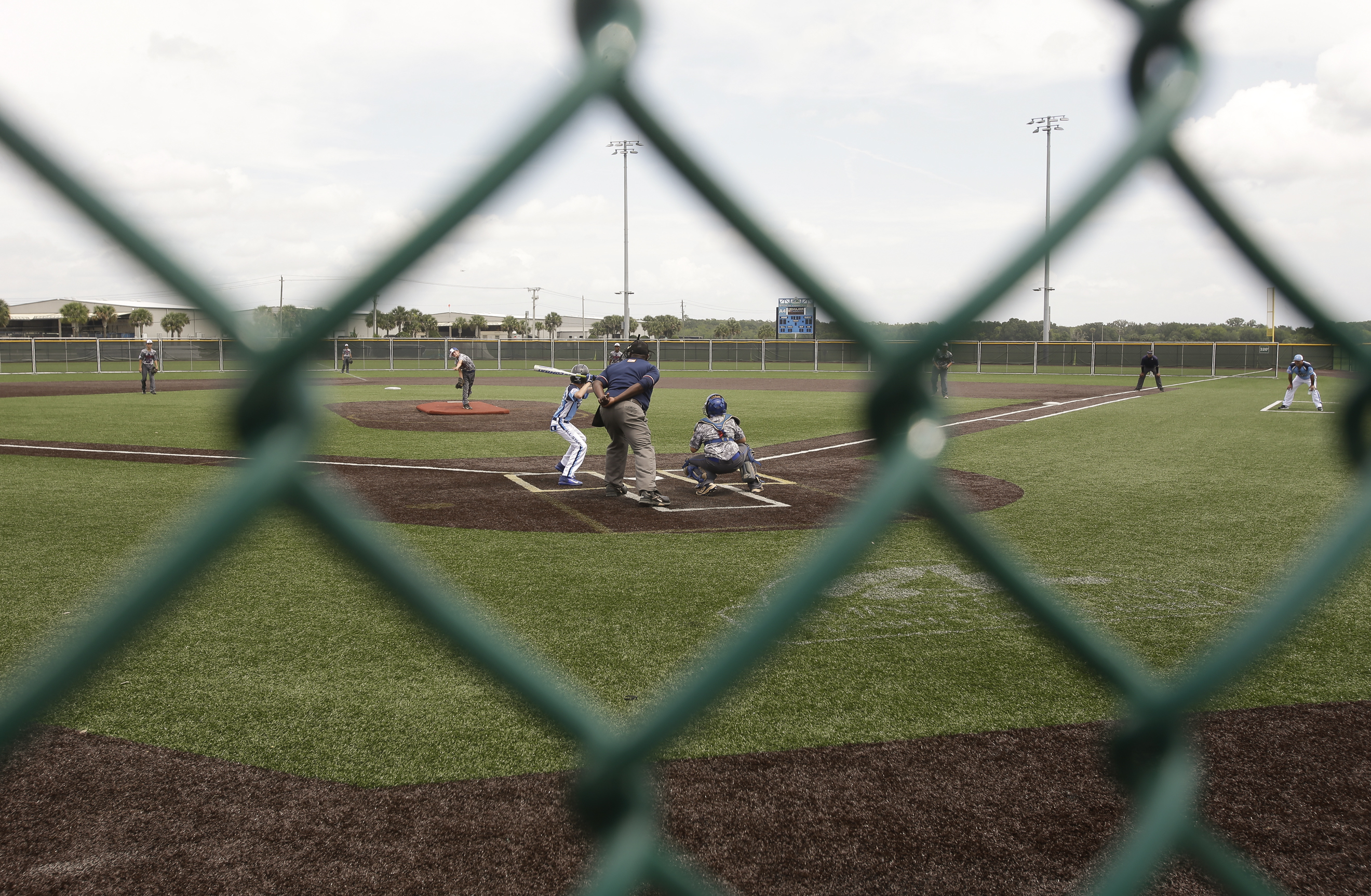 Teen Umpire Helps Youth Baseball Player Caught In Dust Devil