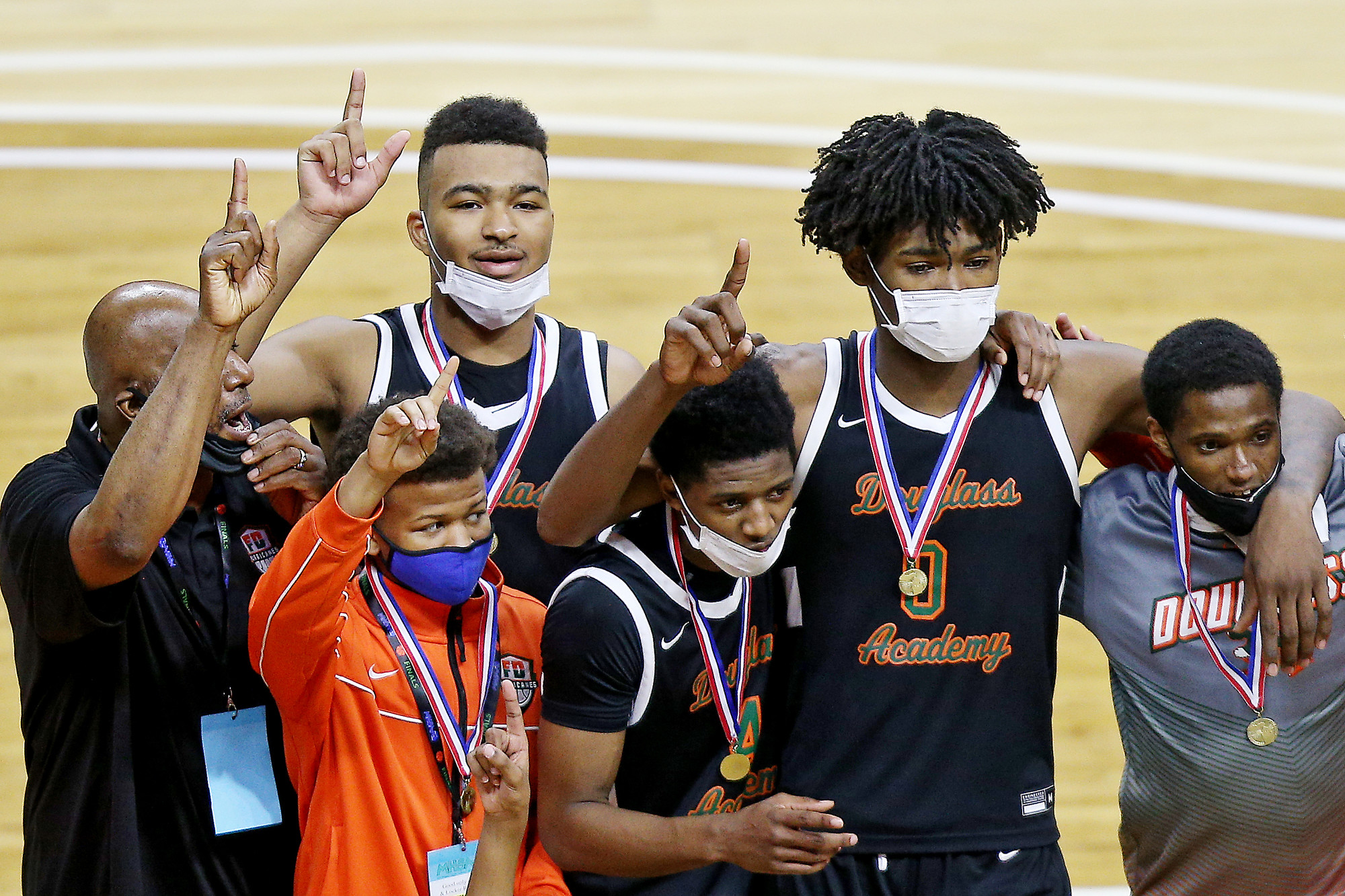 Photos of Detroit Douglass basketball player Pierre Brooks II