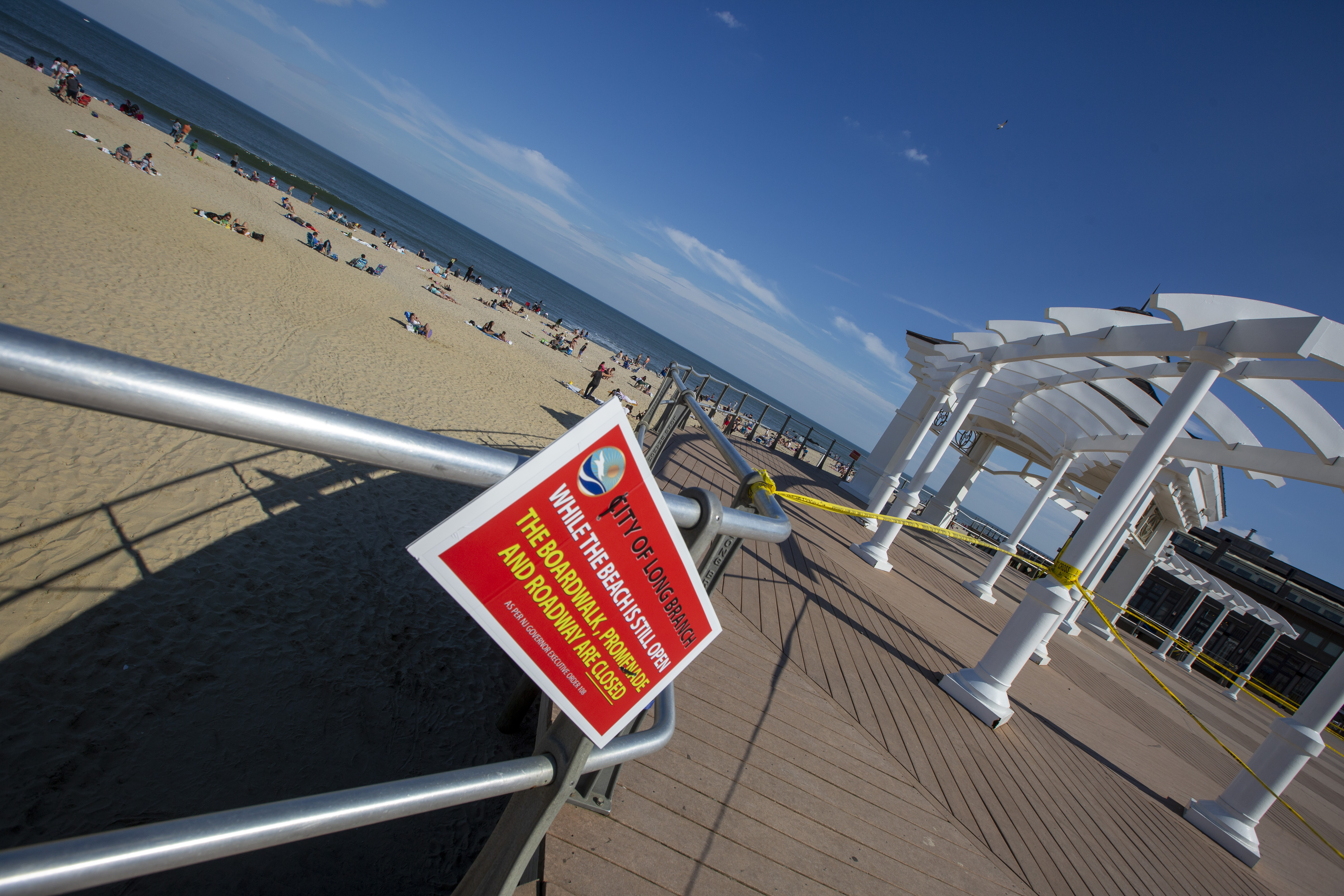 Jersey Shore town's boardwalk reopens after visitors obey social-distancing  rules 