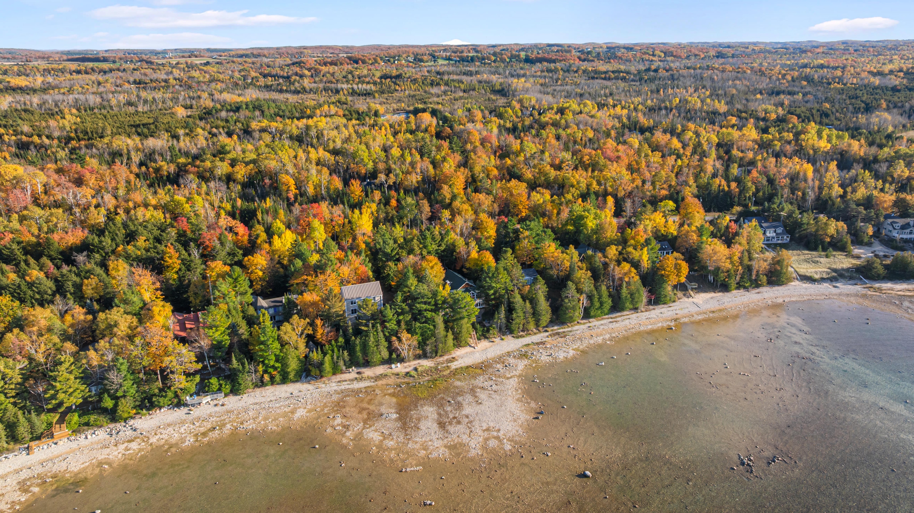 Aerial photographs of 4093 Lake Shore Drive in Charlevoix, this gem is listed at $2,099,900 through Berkshire Hathaway HomeServices Michigan Real Estate – Traverse City and The Crane Group with associate broker Johnny Crane and his brother, co-listing agent Matt Crane.