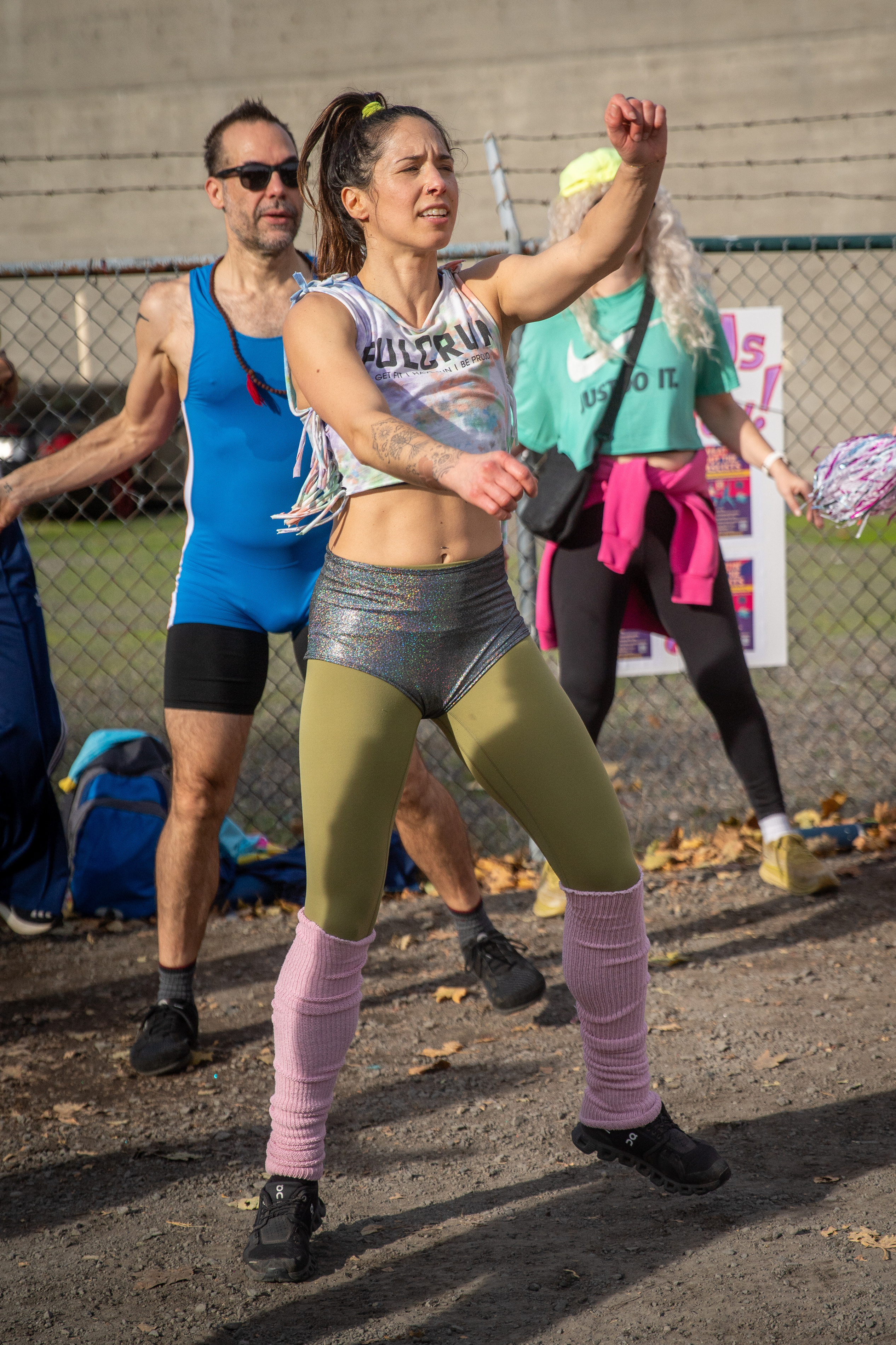 Participants in Fulcrum Fitness’s “Sweatin’ Out the Fascists” held an ’80s-aerobics peaceful protest outside the U.S. Immigration and Customs Enforcement (ICE) facility in South Portland on Sunday, Nov. 9, 2025, collecting donations for the Oregon Food Bank.