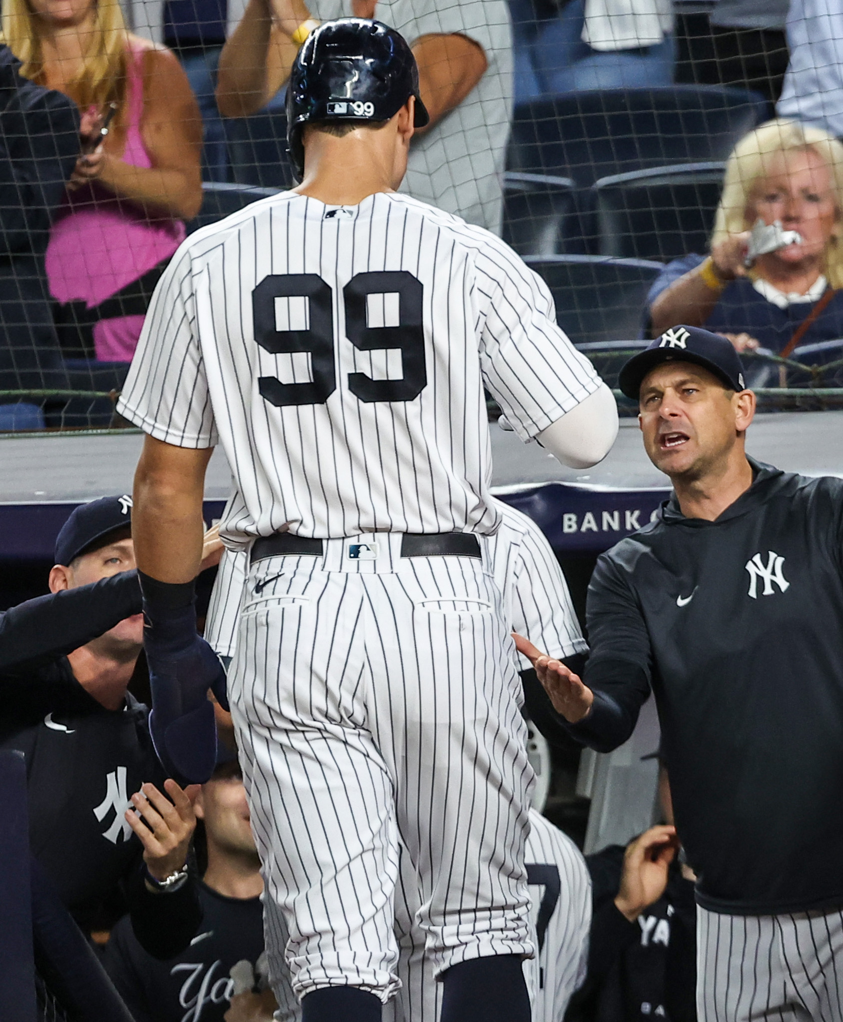 New York Yankees' Aaron Judge, right, is greeted near home plate