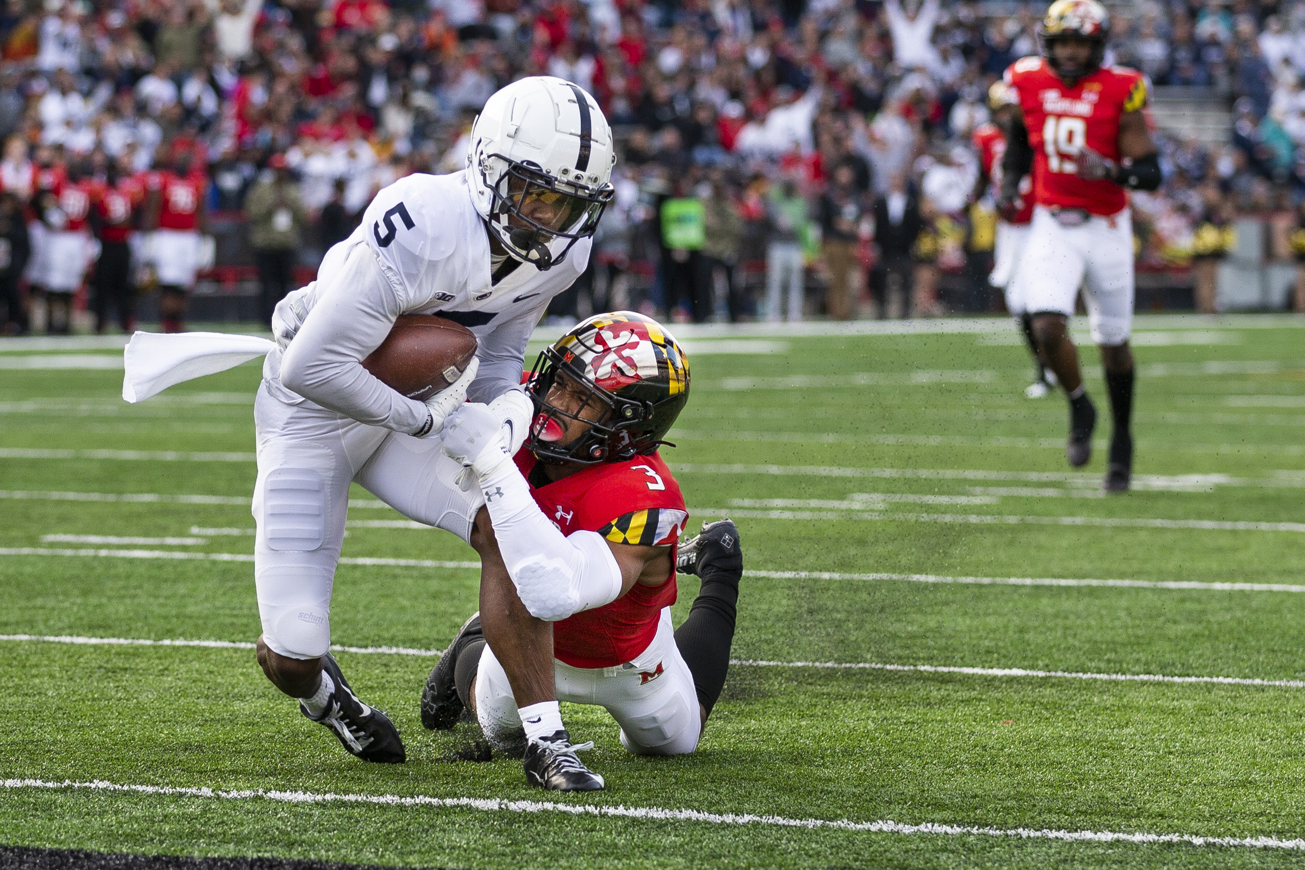 Penn State wide receiver Jahan Dotson goes in for a 38-yard touchdown catch and run as Maryland defensive back Nick Cross defends during the first quarter on Nov. 6, 2021. Joe Hermitt | jhermitt@pennlive.com