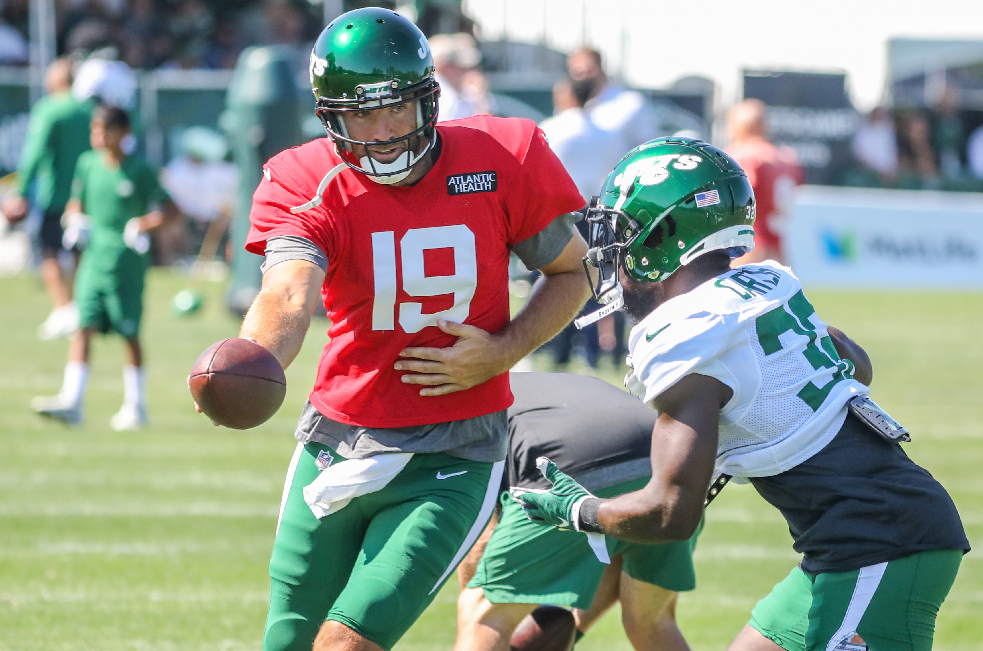 New York Jets running back Michael Carter (32) is tackled during