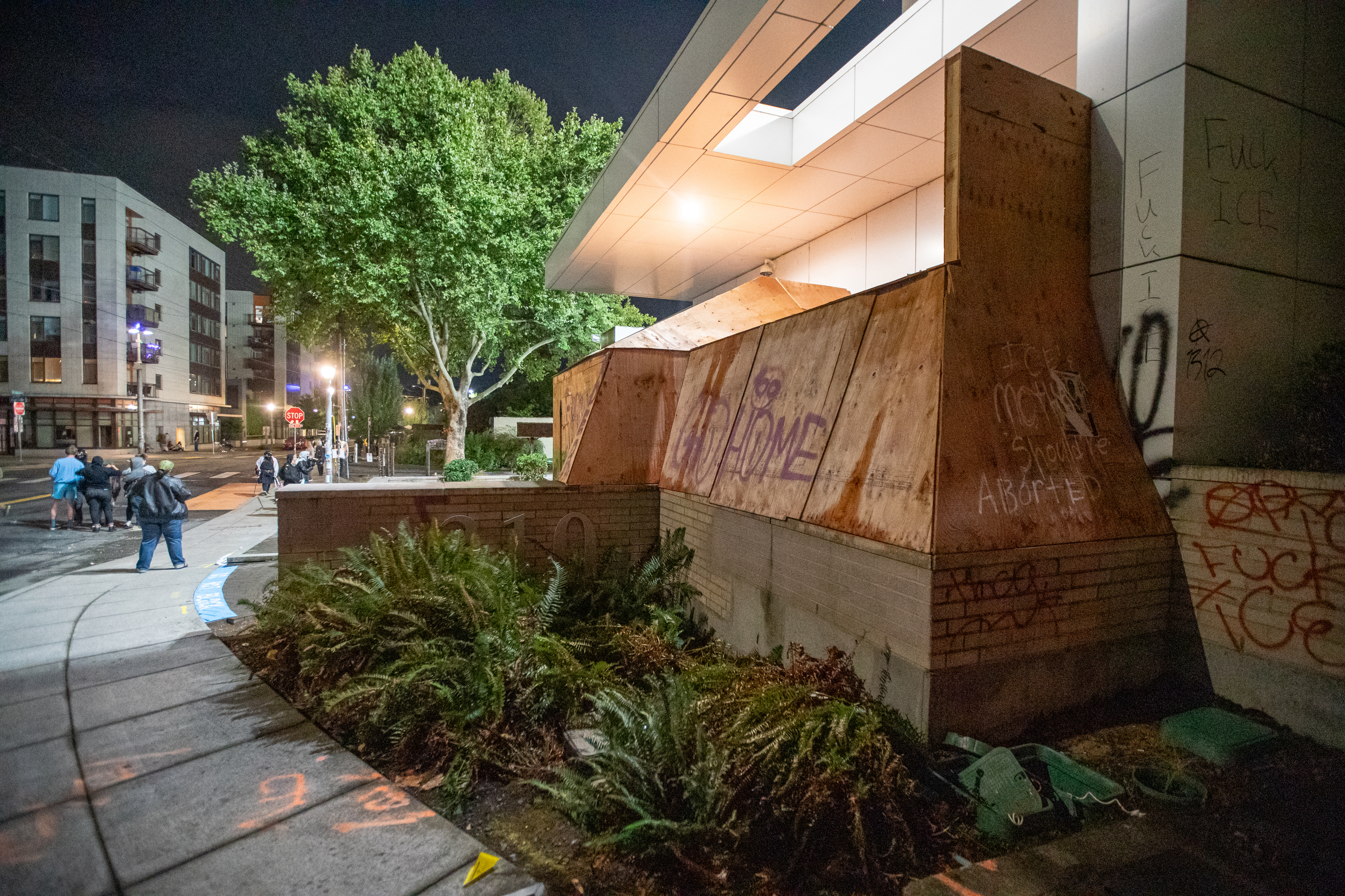 Protesters gather outside the boarded-up U.S. Immigration and Customs Enforcement building in South Portland on Monday, Sept. 8, 2025, days after President Donald Trump suggested federal intervention.