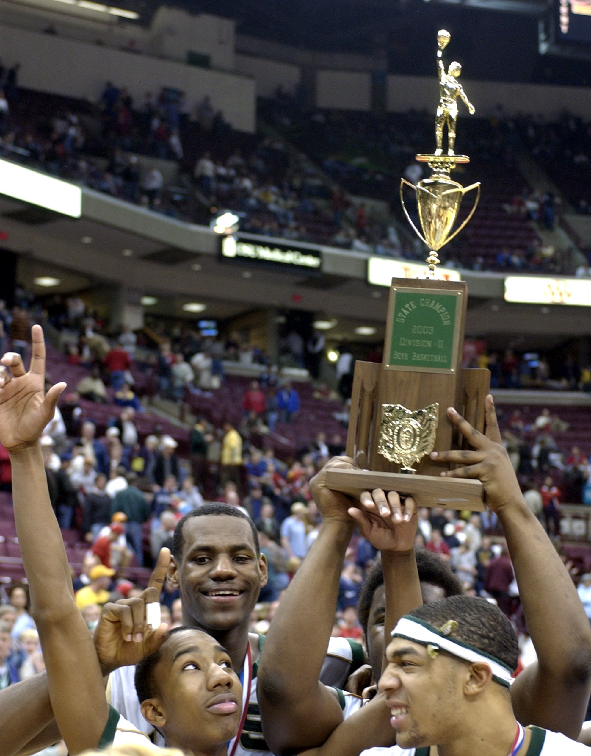 Celebrating their victory at the State Championships St. Vincent-St. Mary players LeBron James(back left), Sean Cotton(back right) Dru Joyce(left front) and Romeo Travis(right front) hold the 1st place trophy overhead.(Roadell Hickman/The Plain Dealer)
