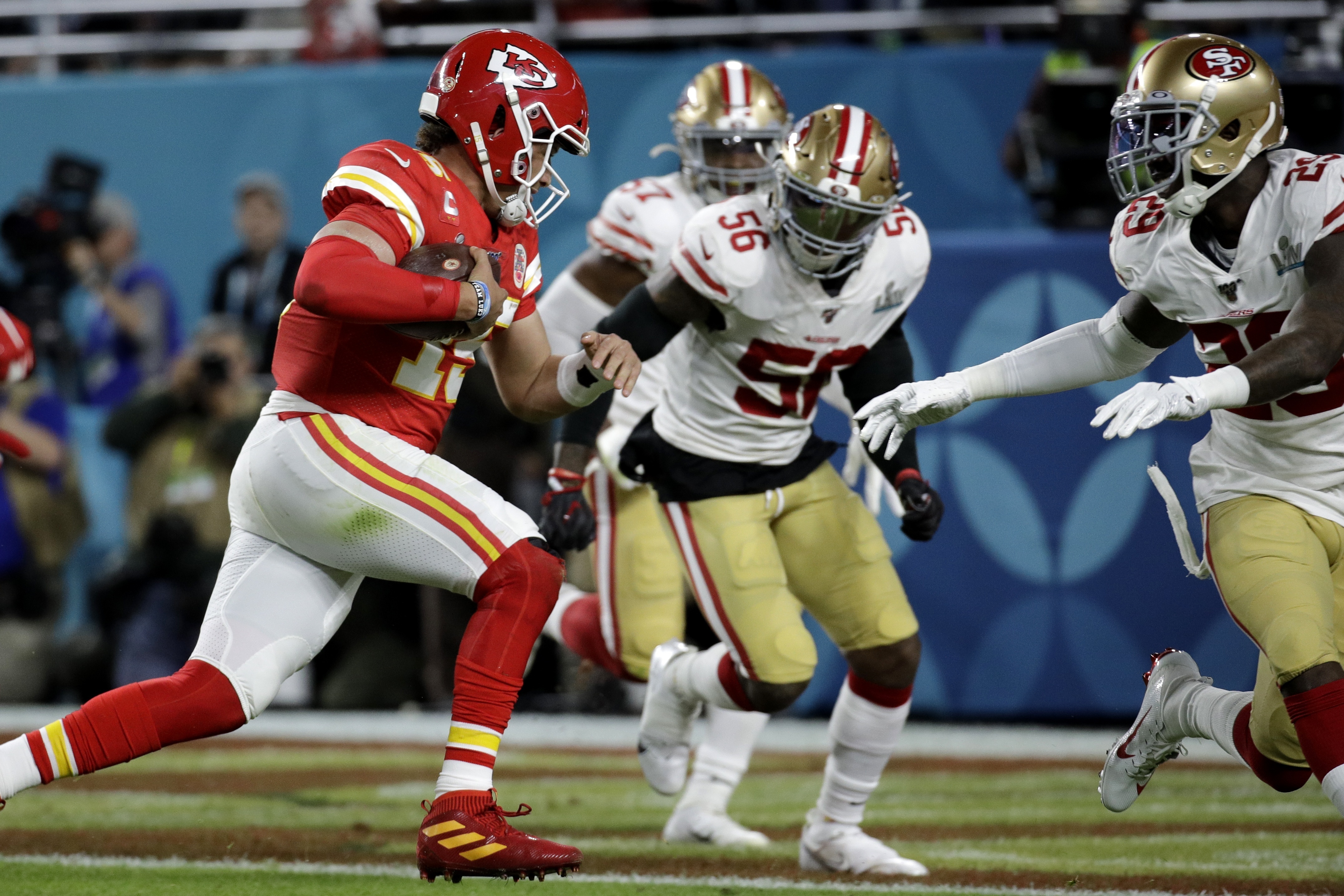 Kansas City Chiefs' Demone Harris (52) plays with the confetti, at