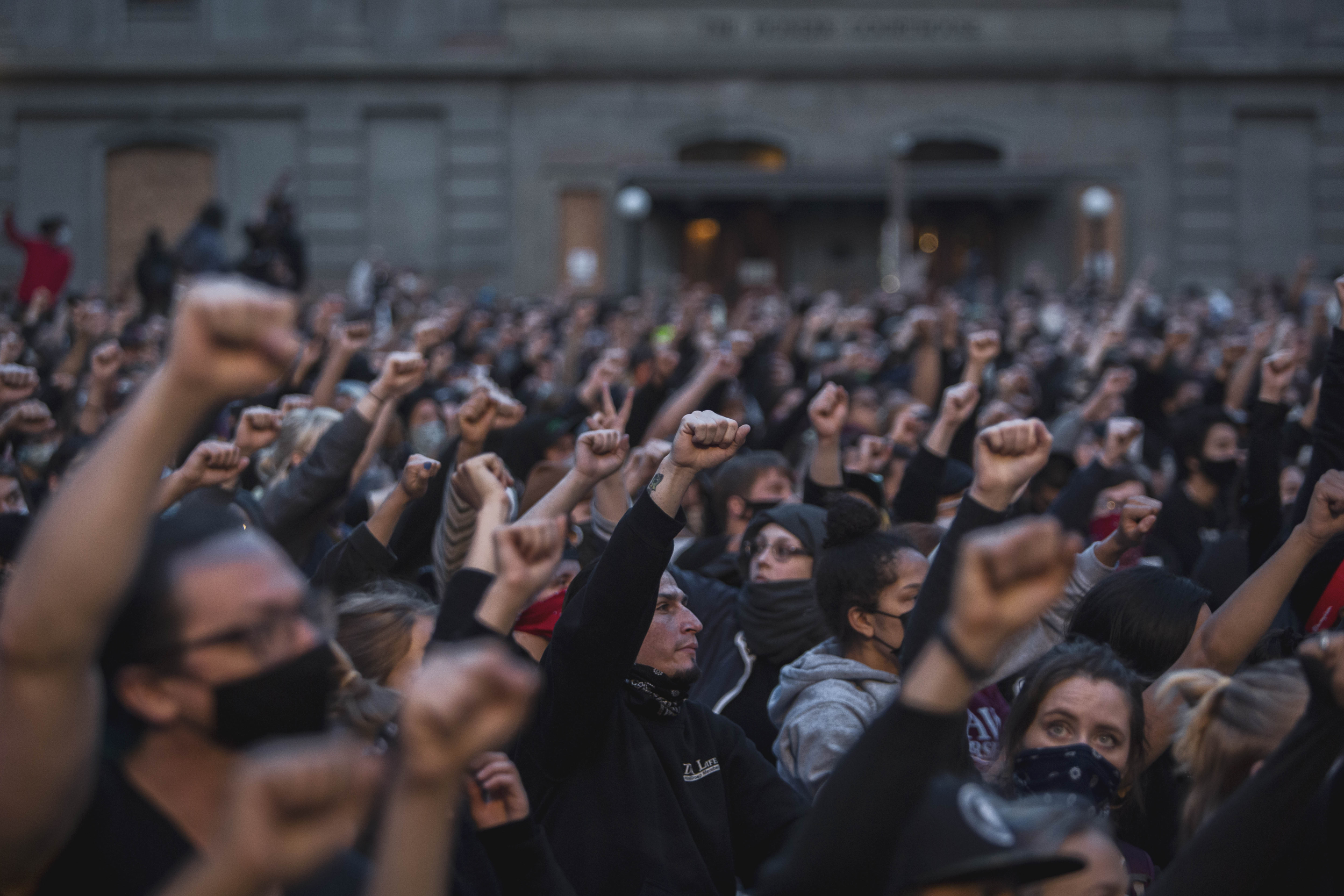 Protesters raise their fists in solidarity during speeches in Pioneer Square on Tuesday evening, June 3. Protests continued for a sixth night in Portland, demonstrating against the death of George Floyd, a black man killed by police in Minneapolis. Brooke Herbert / Staff