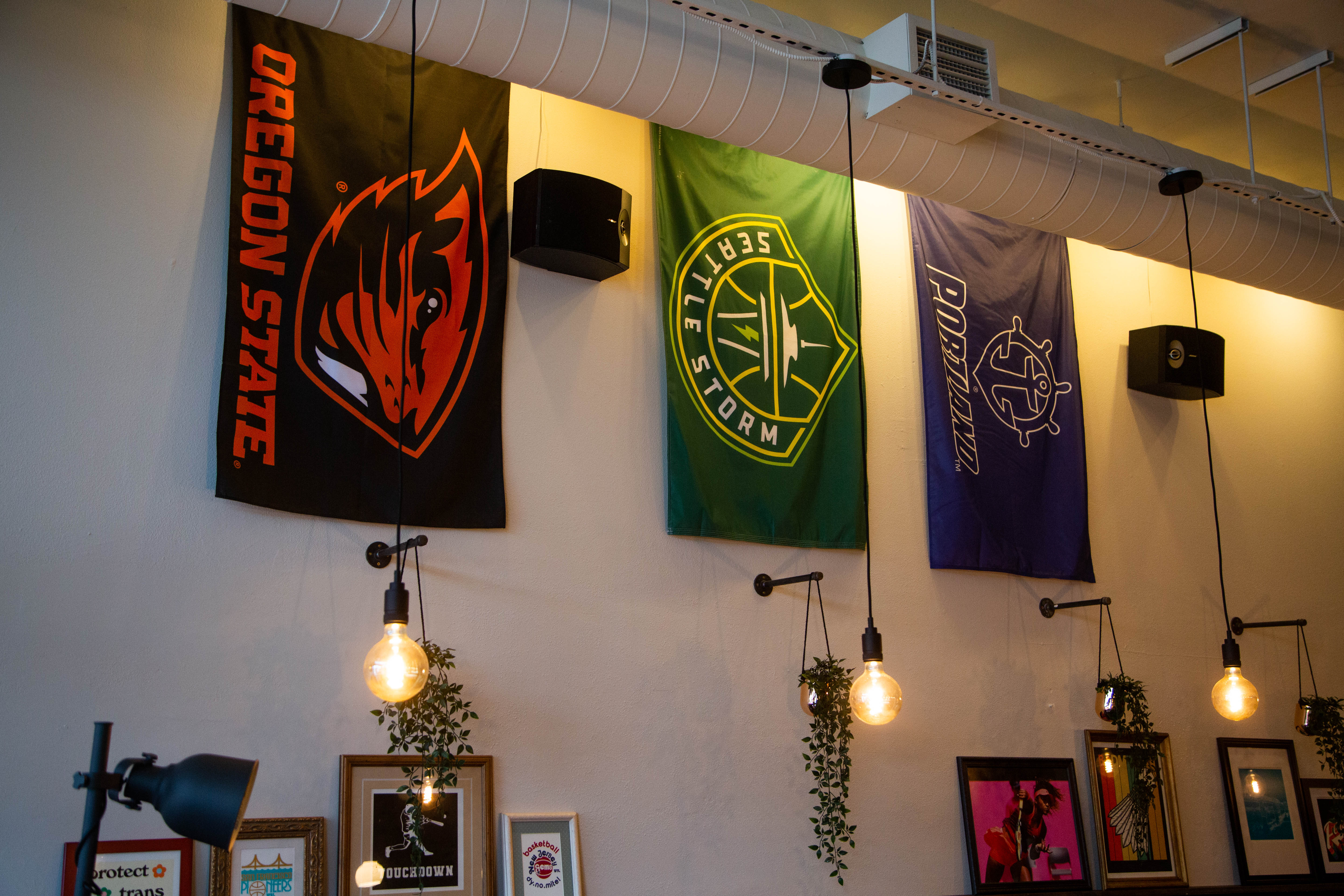 Banners for Oregon State, Seattle Storm and University of Portland on a wall.