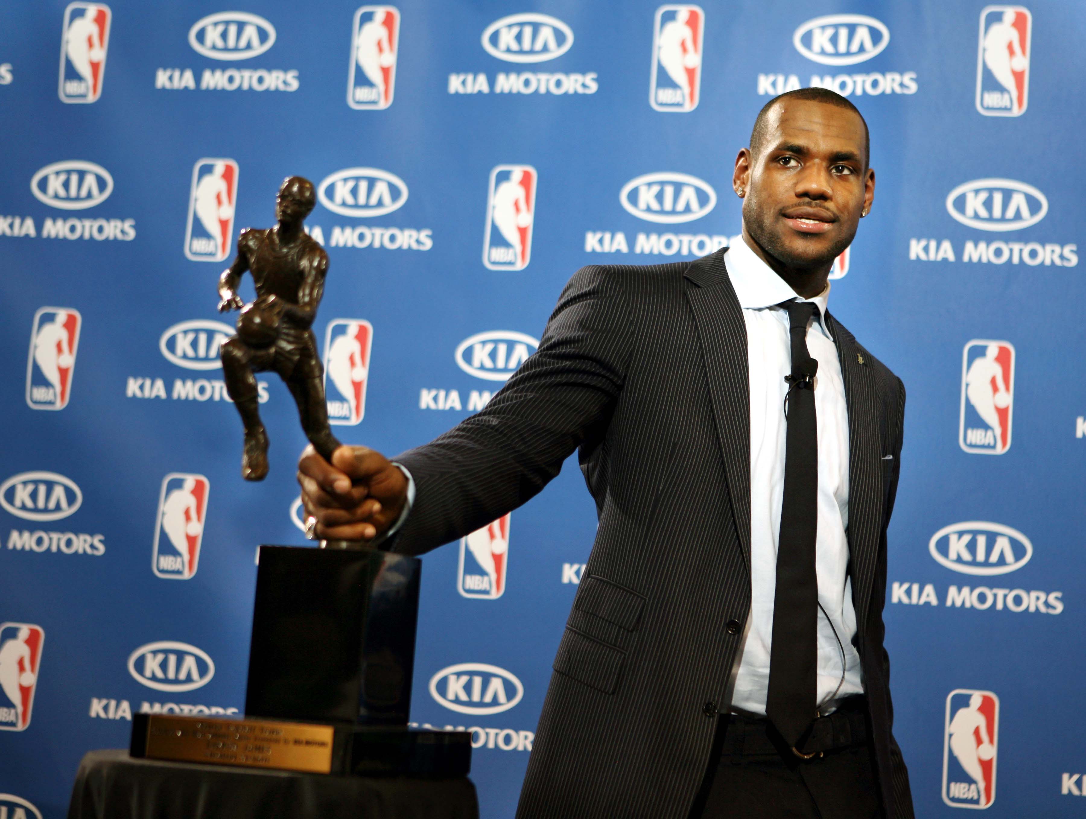 LeBron James holds the NBA Most Valuable Player trophy after being named the leagues outstanding player Monday, May 4, 2009.  James held the trophy presentation at his former high school, St. Vincent-St. Mary High School in Akron.  (Gus Chan / The Plain Dealer) 