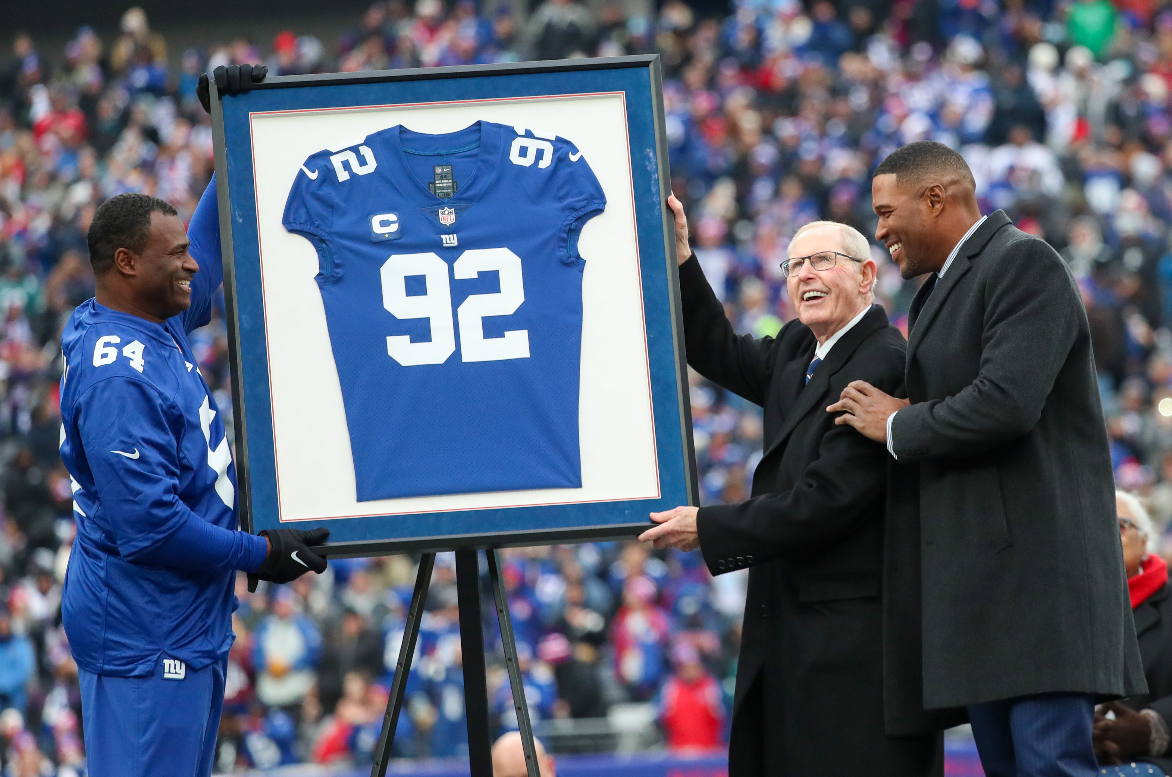 Former New York Giants linebacker Jesse Armstead, head coach Tom Coughlin and Michael Strahan during a halftime ceremony to retire Strahan’s No. 92 jersey on Sunday, Nov. 28, 2021 at MetLife Stadium.