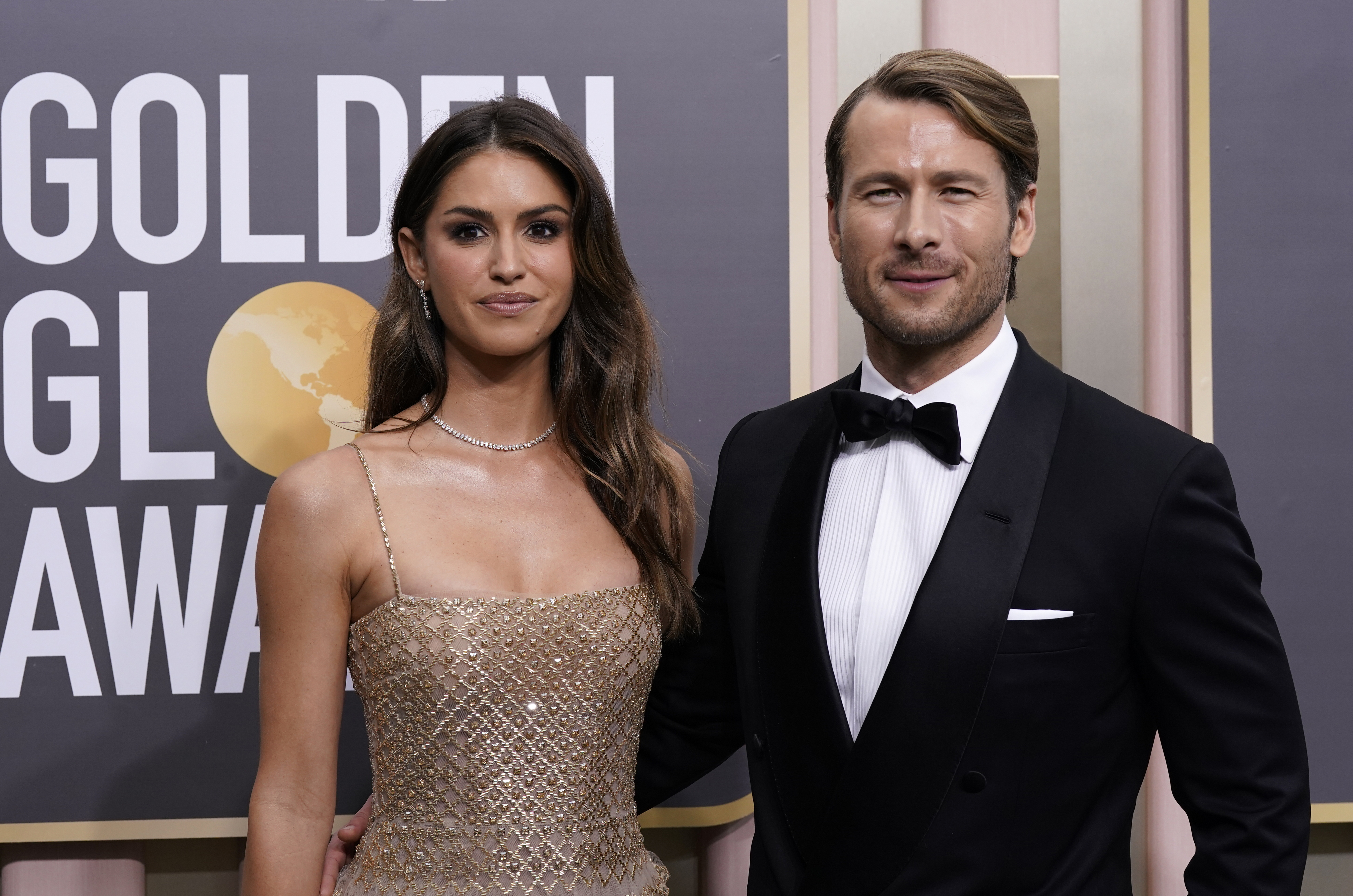 Gigi Paris, left, and Glen Powell arrive at the 80th annual Golden Globe Awards at the Beverly Hilton Hotel on Tuesday, Jan. 10, 2023, in Beverly Hills, Calif. (Photo by Jordan Strauss/Invision/AP)