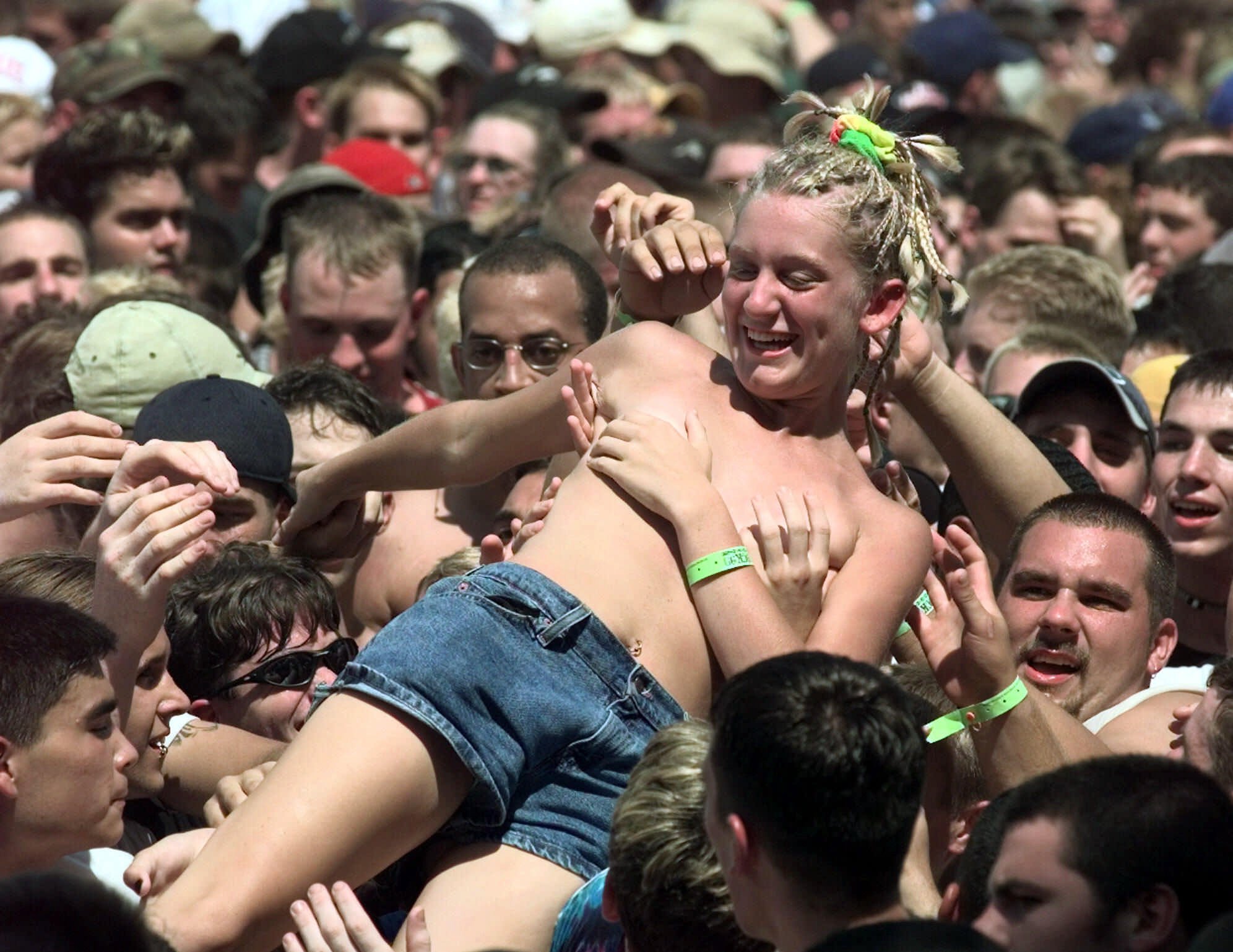 A girl body surfs as the Godfather of Soul James Brown opens Woodstock &apo...