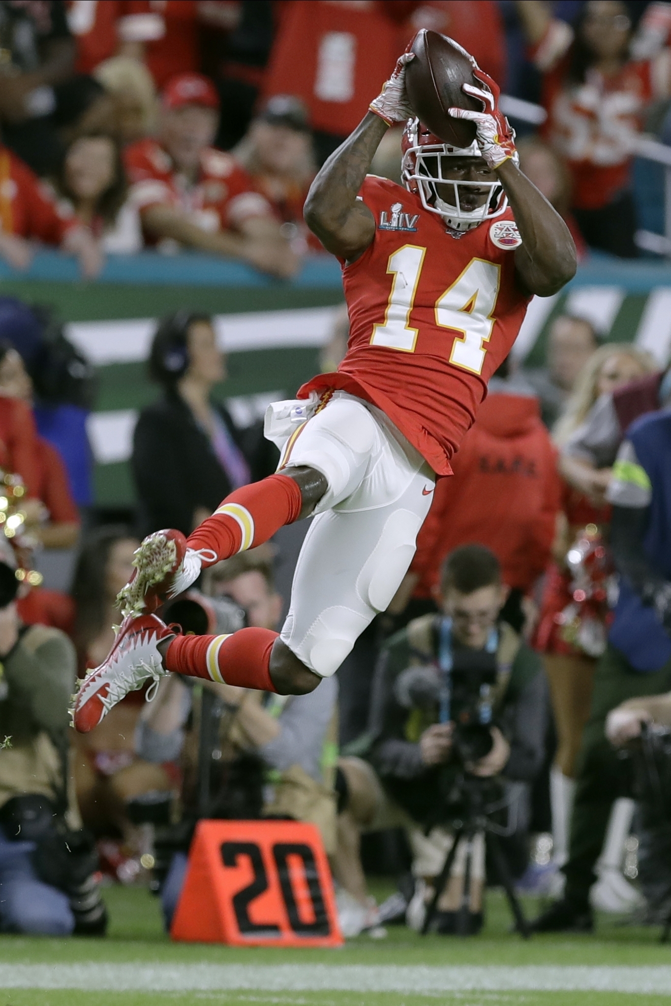 Kansas City Chiefs' Demone Harris (52) plays with the confetti, at