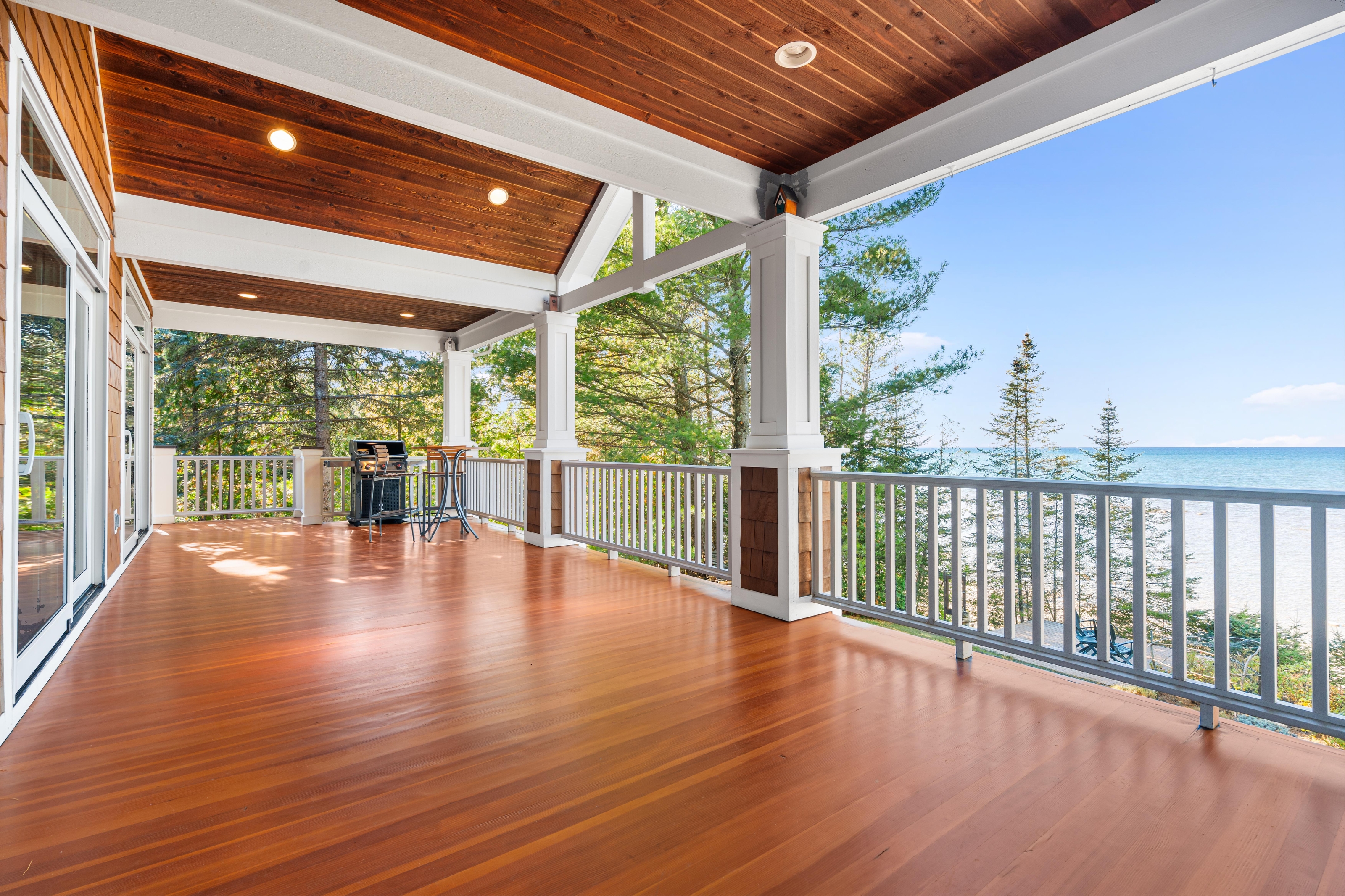 Exterior photographs of 4093 Lake Shore Drive in Charlevoix, this gem is listed at $2,099,900 through Berkshire Hathaway HomeServices Michigan Real Estate – Traverse City and The Crane Group with associate broker Johnny Crane and his brother, co-listing agent Matt Crane.