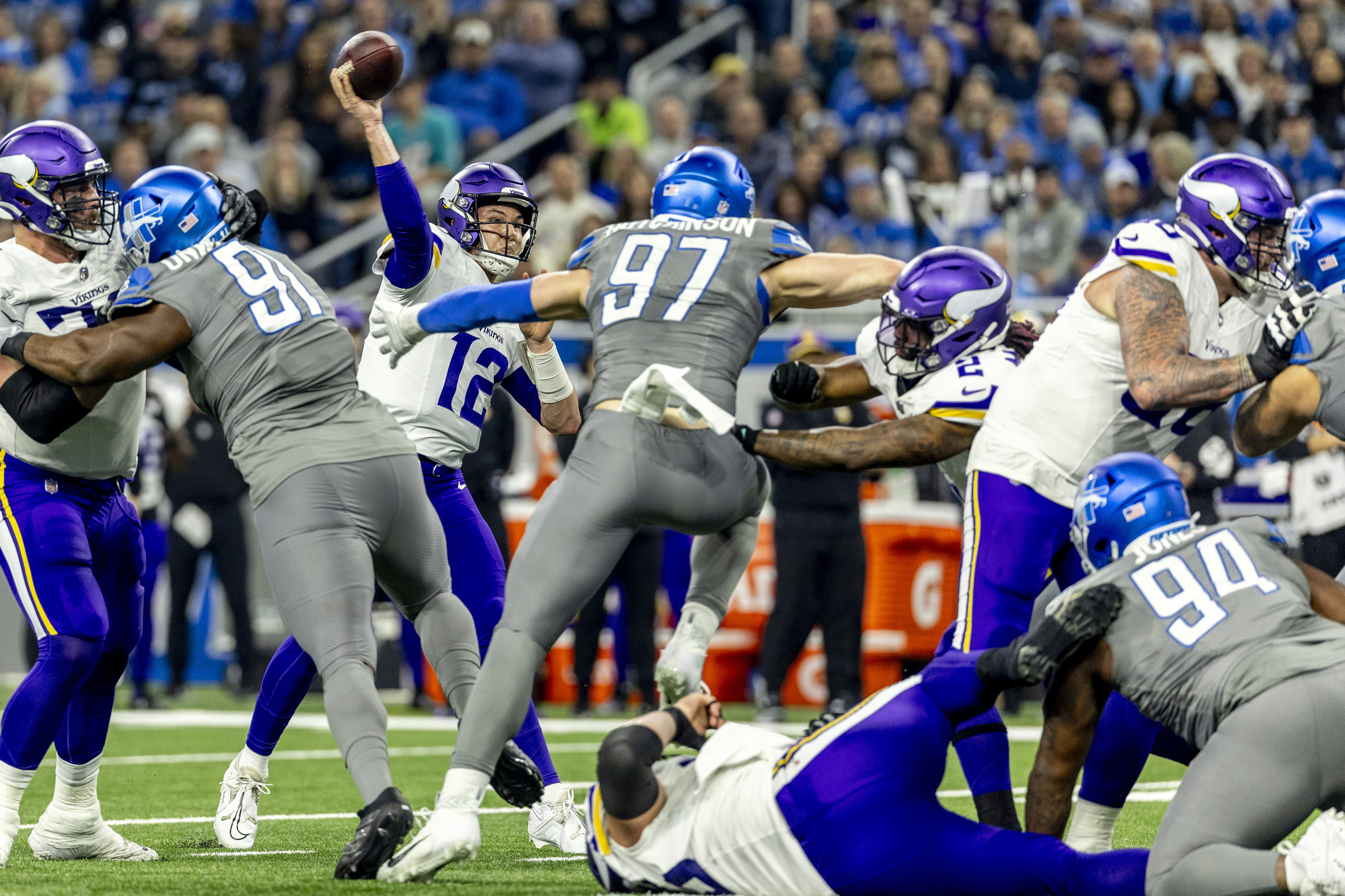 Minnesota Vikings quarterback Nick Mullens throws a pass under heavy Detroit Lions defensive pressure in the last regular season game on Sunday, Jan. 7, 2024 at Ford Field in Detroit.