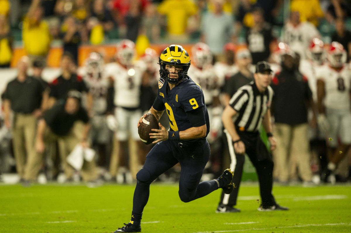 M Den selling Michigan football jerseys with players' names on the back 