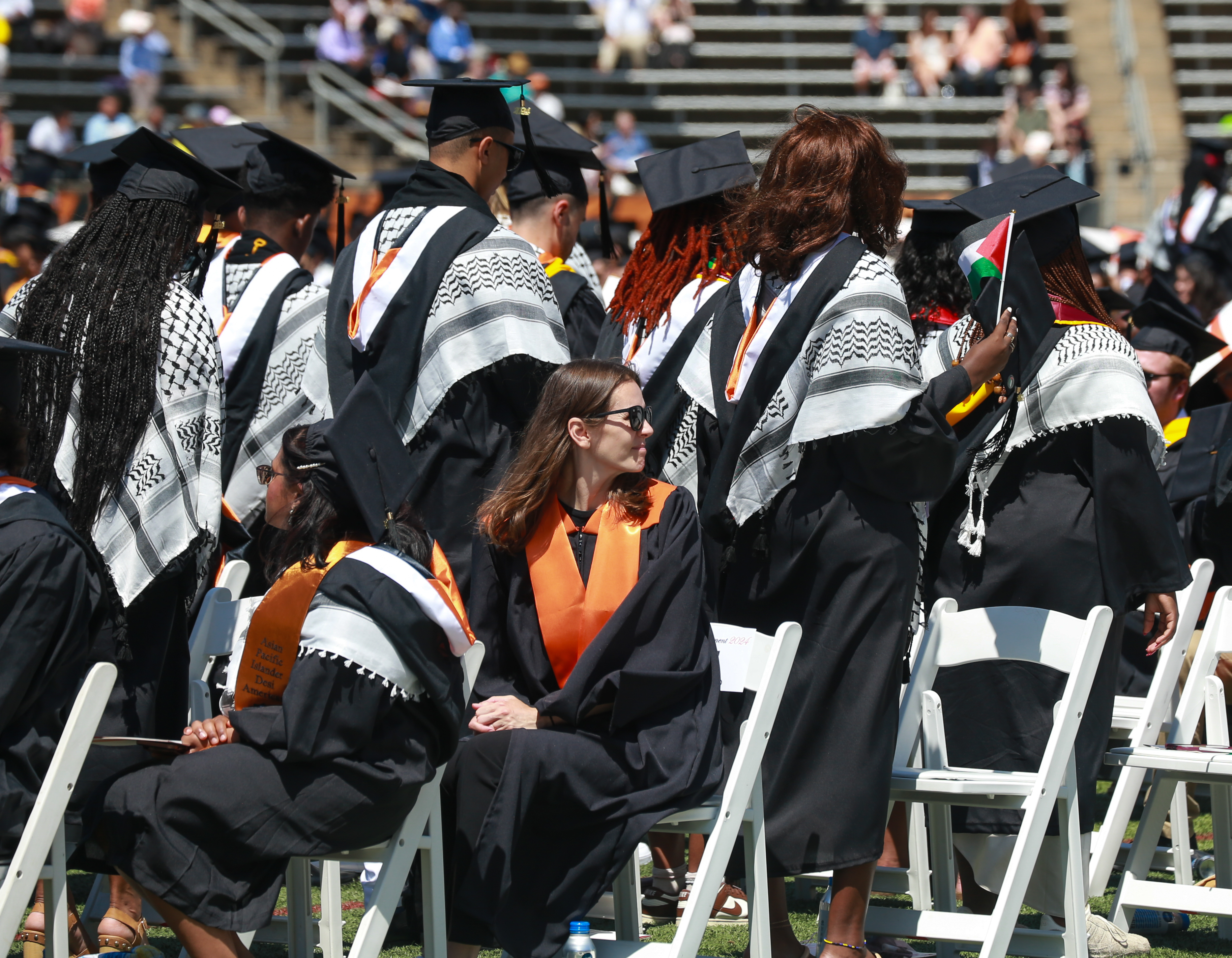 Group of grads turn their backs on Princeton U. president in  pro-Palestinian protest - nj.com, image size:3738x2907