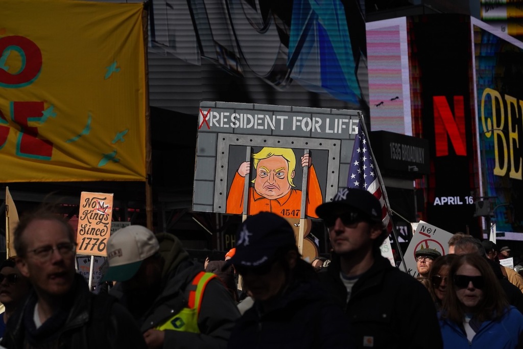Photos: Tens of thousands march through Times Square in ‘No Kings ...
