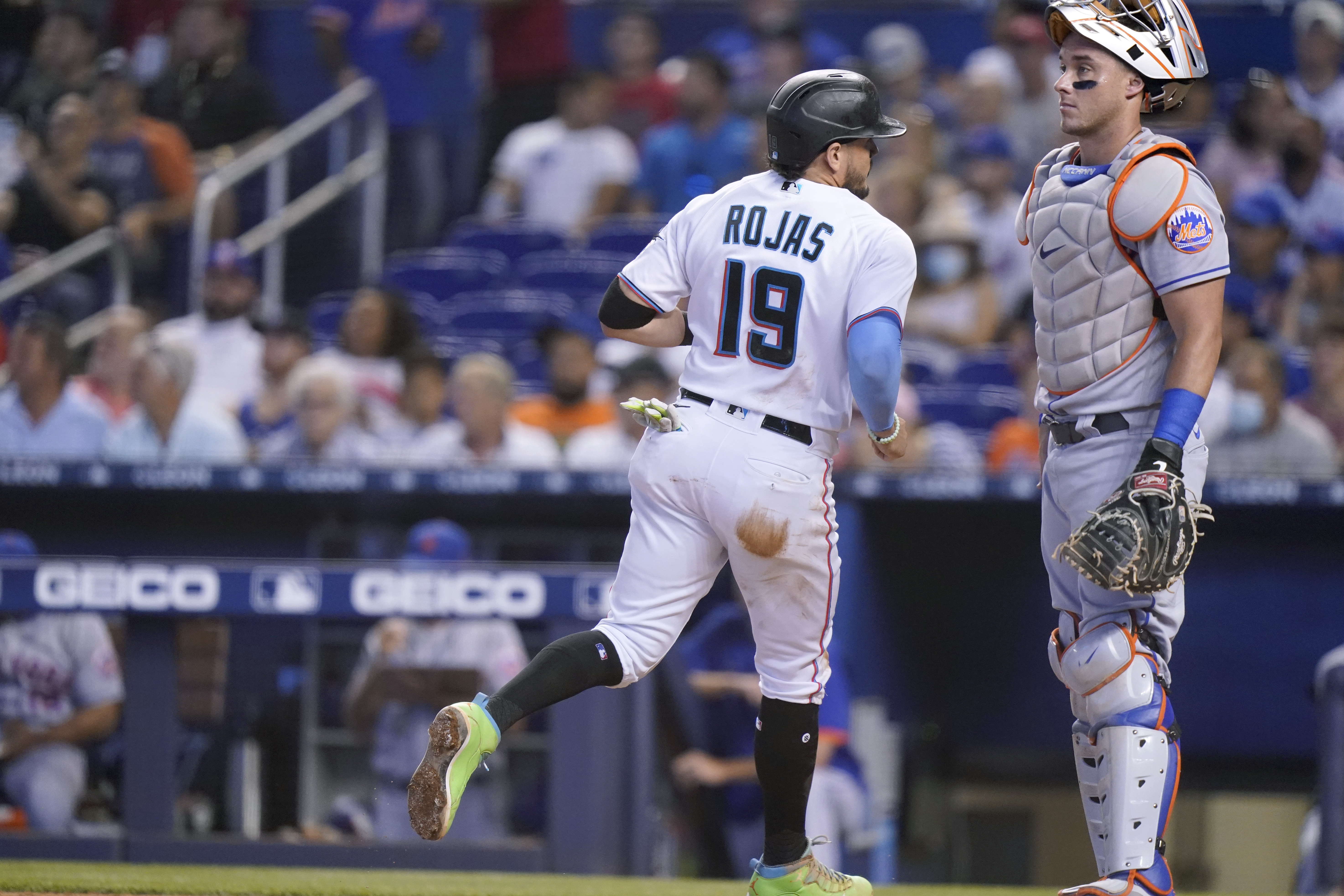 Miami Marlins' Lewis Brinson (9) strikes out with runners on base