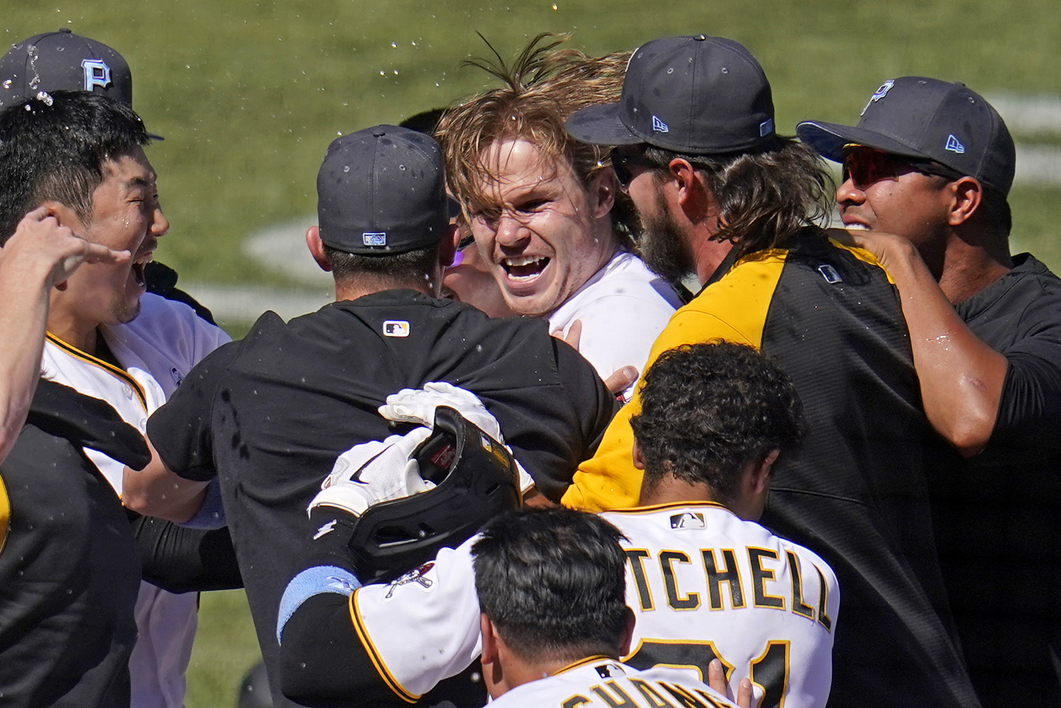 Jack Suwinski of the Pittsburgh Pirates high fives with JT