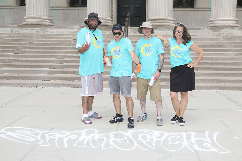 L to R- Chalk artists Rich Nice, Mike Pastoreck, and Jeff Nero with Common Wealth Murals director Britt Ruhe on the city hall steps at Chalk for Change 2022 in Springfield  on July 16th. (Ed Cohen Photo)