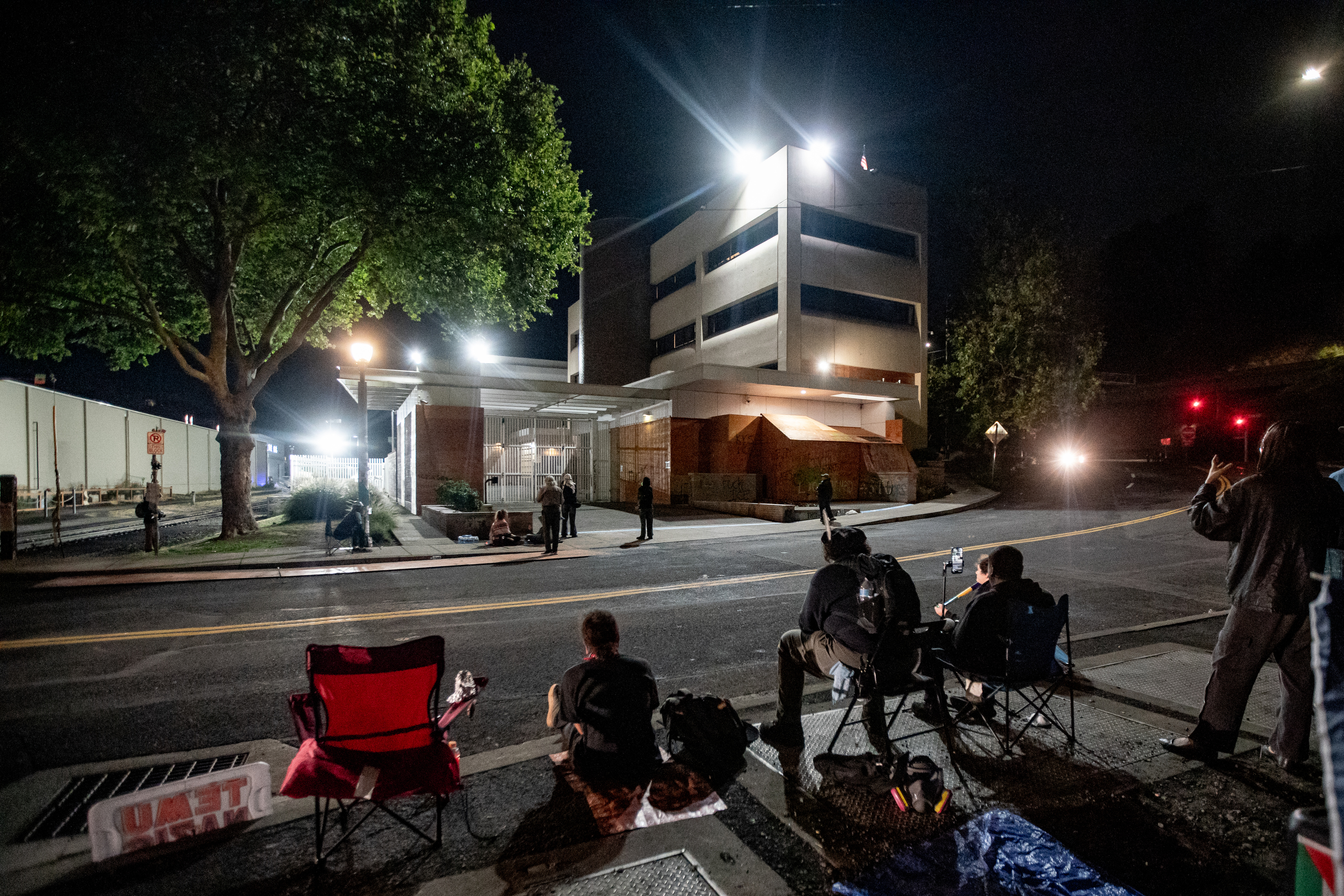 Protesters gather outside the boarded-up U.S. Immigration and Customs Enforcement building in South Portland on Monday, Sept. 8, 2025, days after President Donald Trump suggested federal intervention.