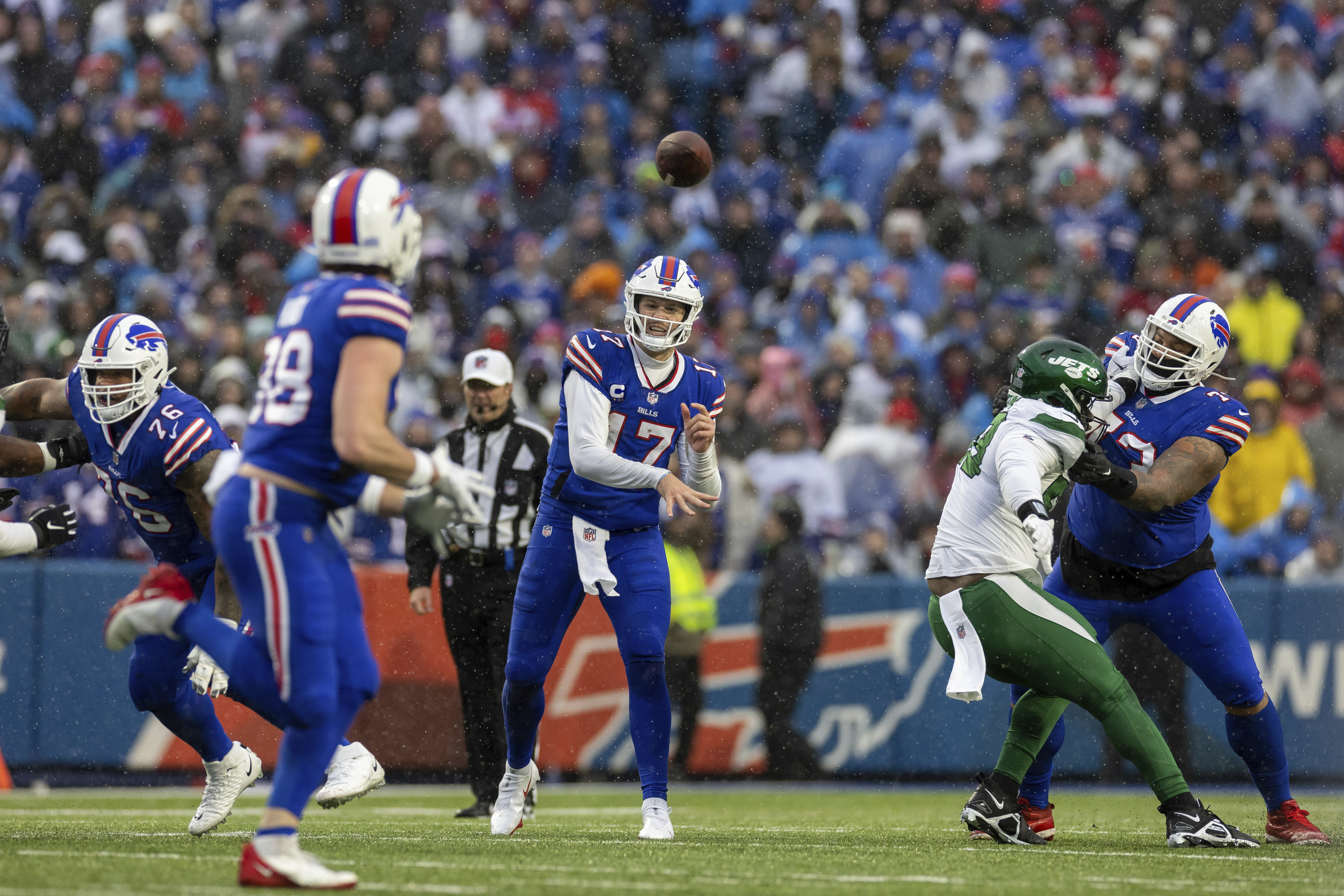 Buffalo Bills tackle Dion Dawkins (73) runs on the field during the second  half of an NFL football game against the New York Jets in Orchard Park,  N.Y., Sunday, Dec. 11, 2022. (