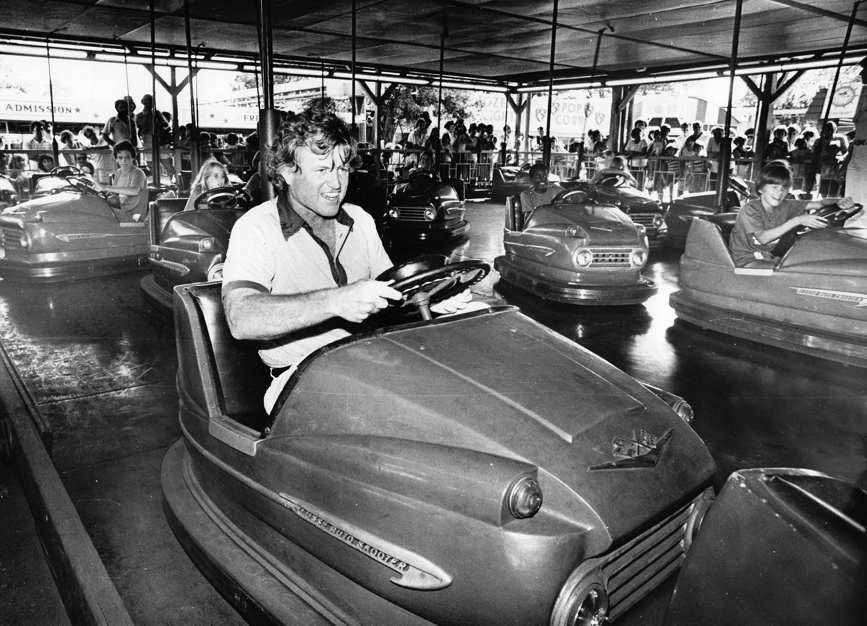 August 7, 1979 - Agawam - Staff photo by Mark M. Murray - Sen. Edward M. Kennedy, D-Mass., rides the bumper cars during a visit with his family to Riverside Park.