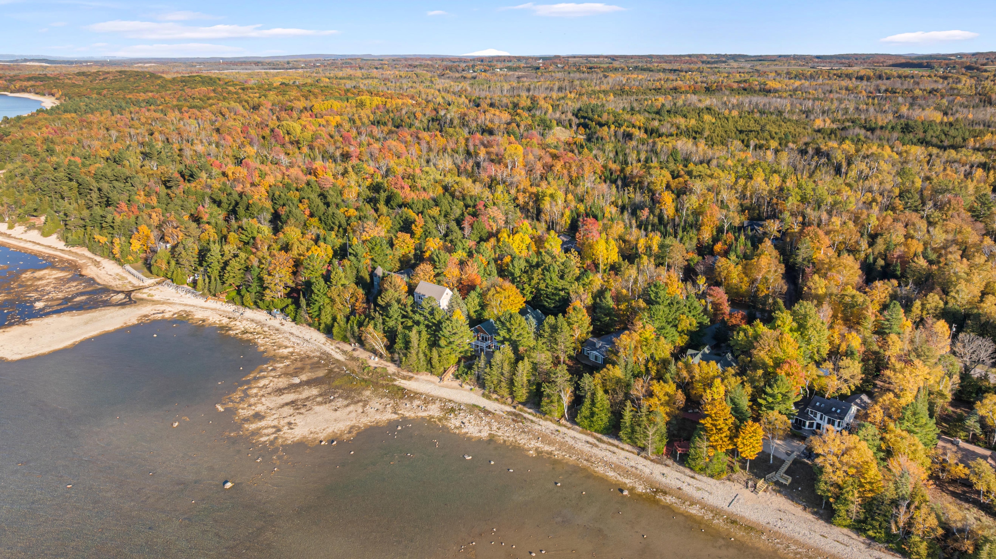 Aerial photographs of 4093 Lake Shore Drive in Charlevoix, this gem is listed at $2,099,900 through Berkshire Hathaway HomeServices Michigan Real Estate – Traverse City and The Crane Group with associate broker Johnny Crane and his brother, co-listing agent Matt Crane.